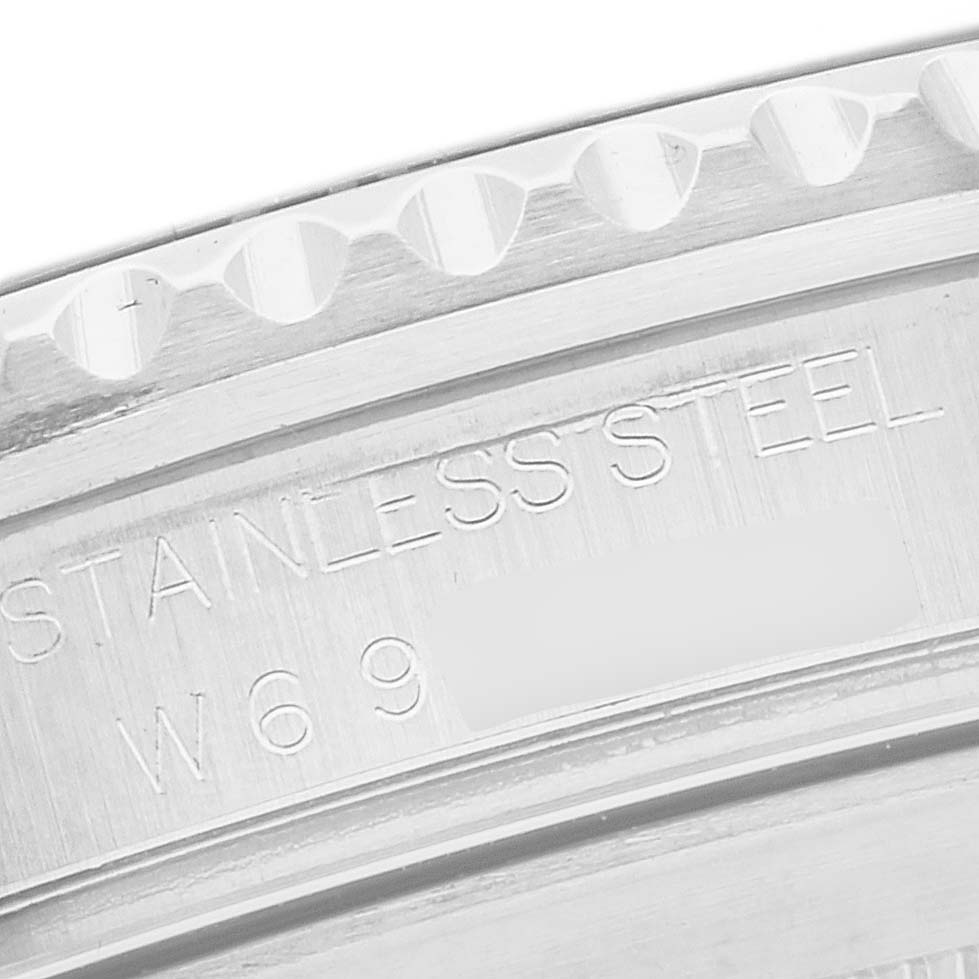 The image shows a close-up of the stainless steel case back of a Rolex Submariner 16610 Men
s Stainless Steel Black Dial 16610 Men
s Stainless Steel Black Dial, highlighting the engraved text.
