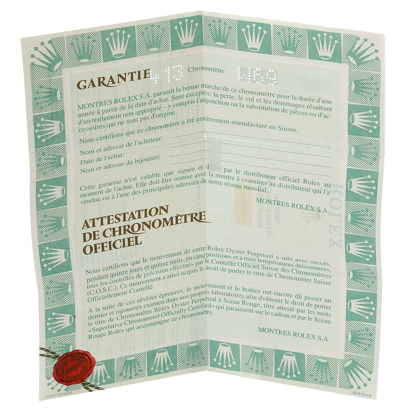 Image shows a folded warranty and chronometer certification document for a Rolex Submariner 16610 Men
s Stainless Steel Black Dial 16610 Men
s Stainless Steel Black Dial watch.