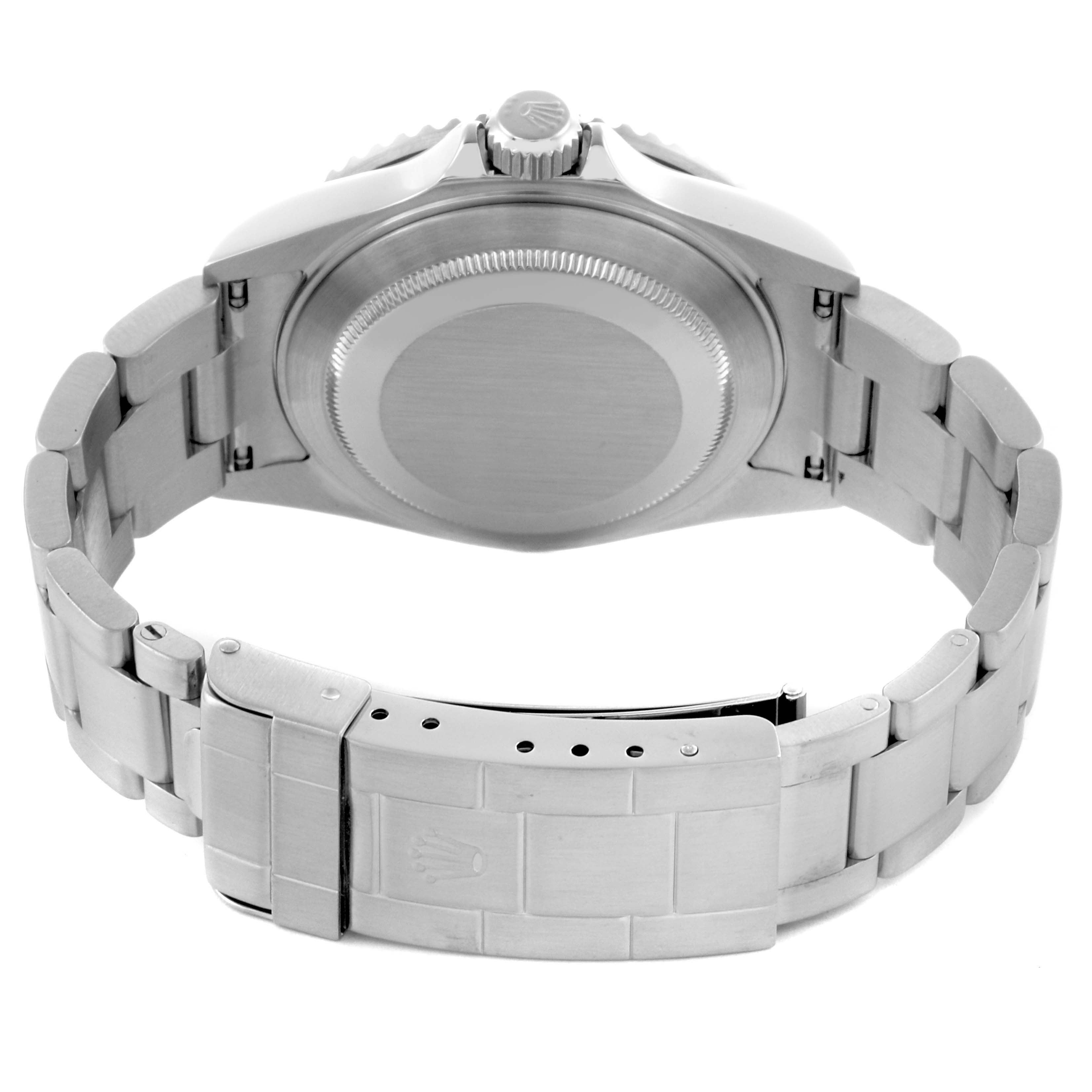 The Rolex Submariner 16610LV Men's Stainless Steel Black Dial 16610LV Men's Stainless Steel Black Dial watch is shown from the back, highlighting the case back, crown, and bracelet clasp.