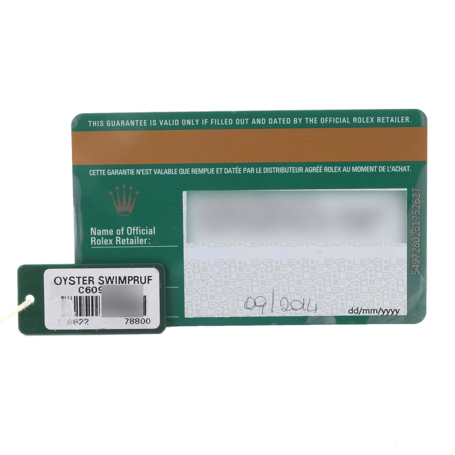 The image shows a green Rolex warranty card and a tag for the Yacht-Master model.