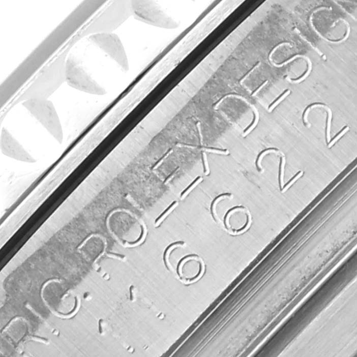 The image shows a close-up of the engraved side details on a Rolex Yacht-Master 116622 Men's Stainless Steel Blue Dial 116622 Men's Stainless Steel Blue Dial watch.