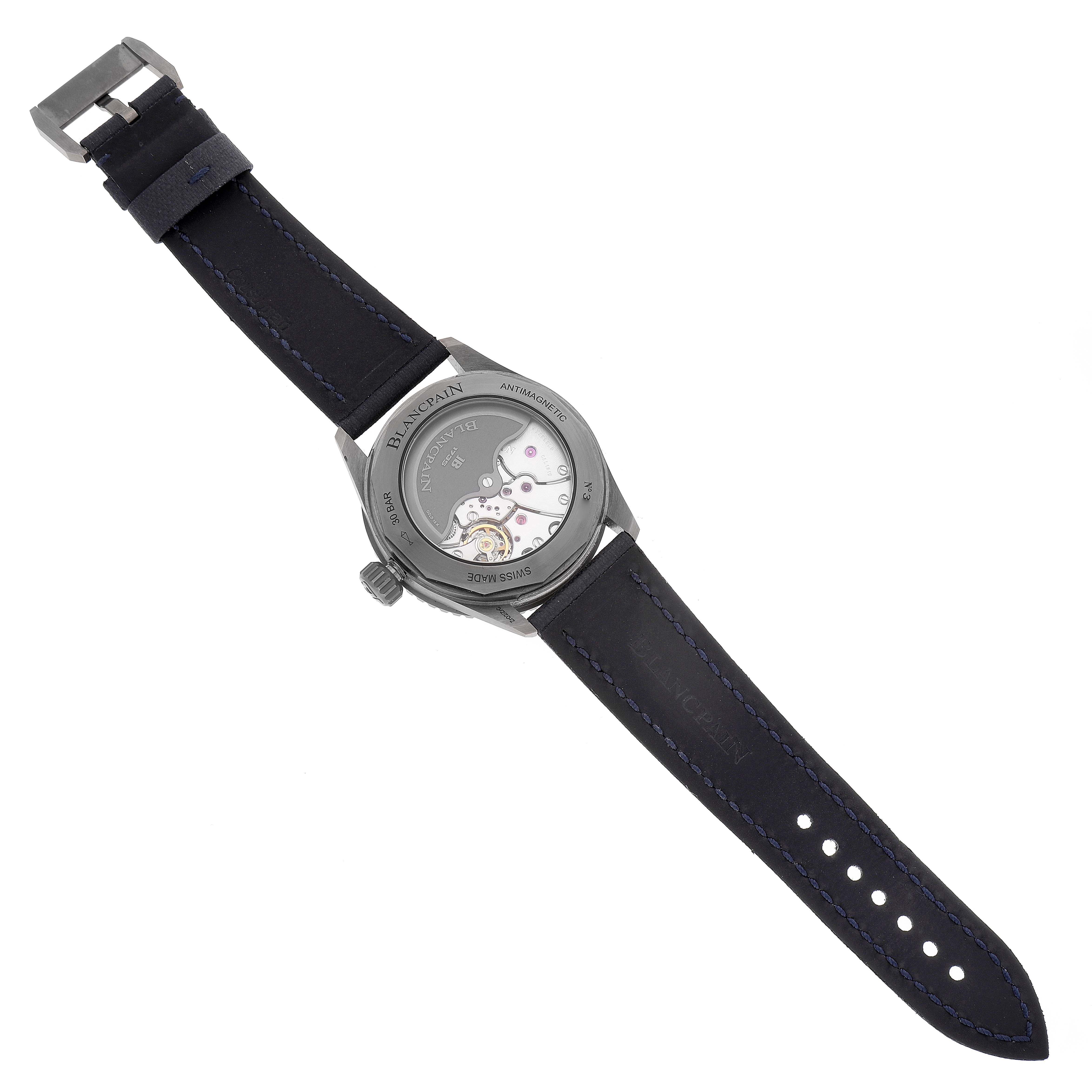 The image shows the back view of a Blancpain Fifty Fathoms 5000-0240-052A Men's Ceramic Blue Dial 5000-0240-052A Men's Ceramic Blue Dial watch, displaying its movement mechanism and leather strap.