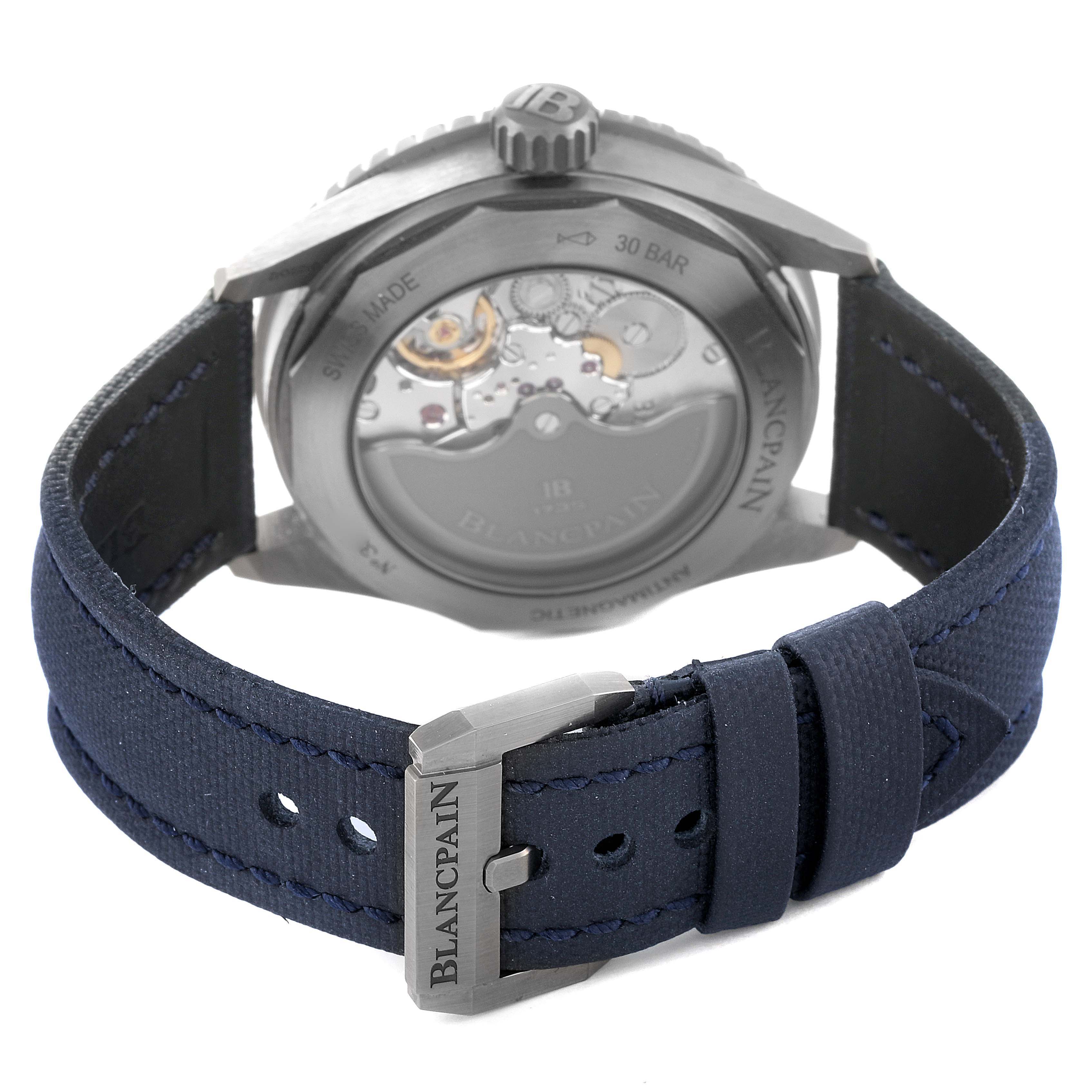 This image shows the back view of the Blancpain Fifty Fathoms 5000-0240-052A Men's Ceramic Blue Dial 5000-0240-052A Men's Ceramic Blue Dial watch, including its automatic movement and navy blue strap with a branded buckle.