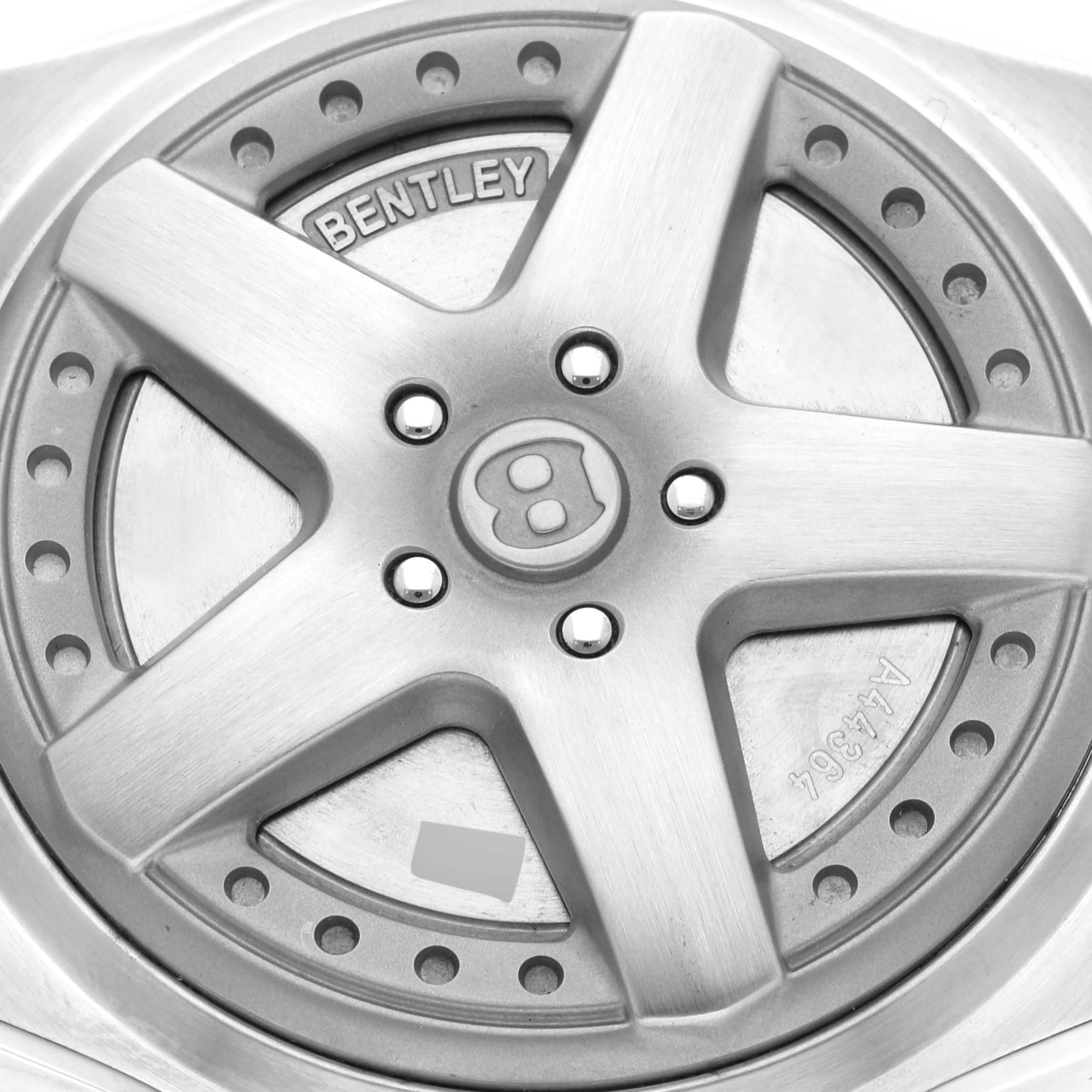 This image shows the case back of the Bentley model watch by Breitling, highlighting its unique design and branding details.