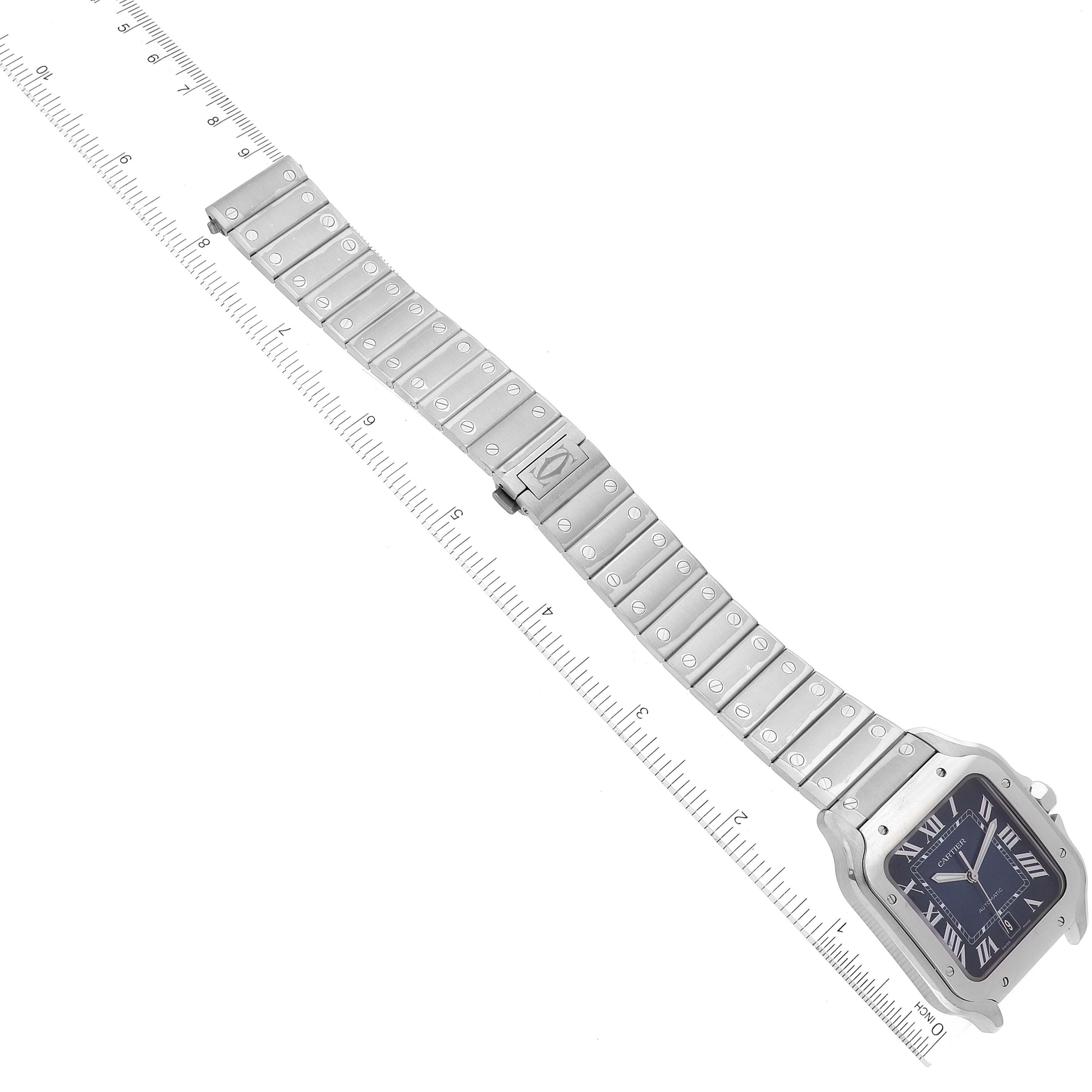 The image shows an angled view of a Cartier Santos WSSA0030 Men's Stainless Steel Blue Dial WSSA0030 Men's Stainless Steel Blue Dial model watch, highlighting its silver metal strap and square dial.