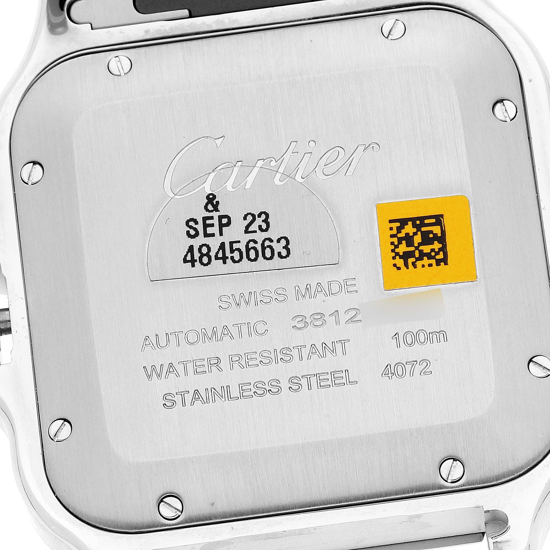 The image shows the back of a Santos by Cartier watch, highlighting its details and inscriptions.