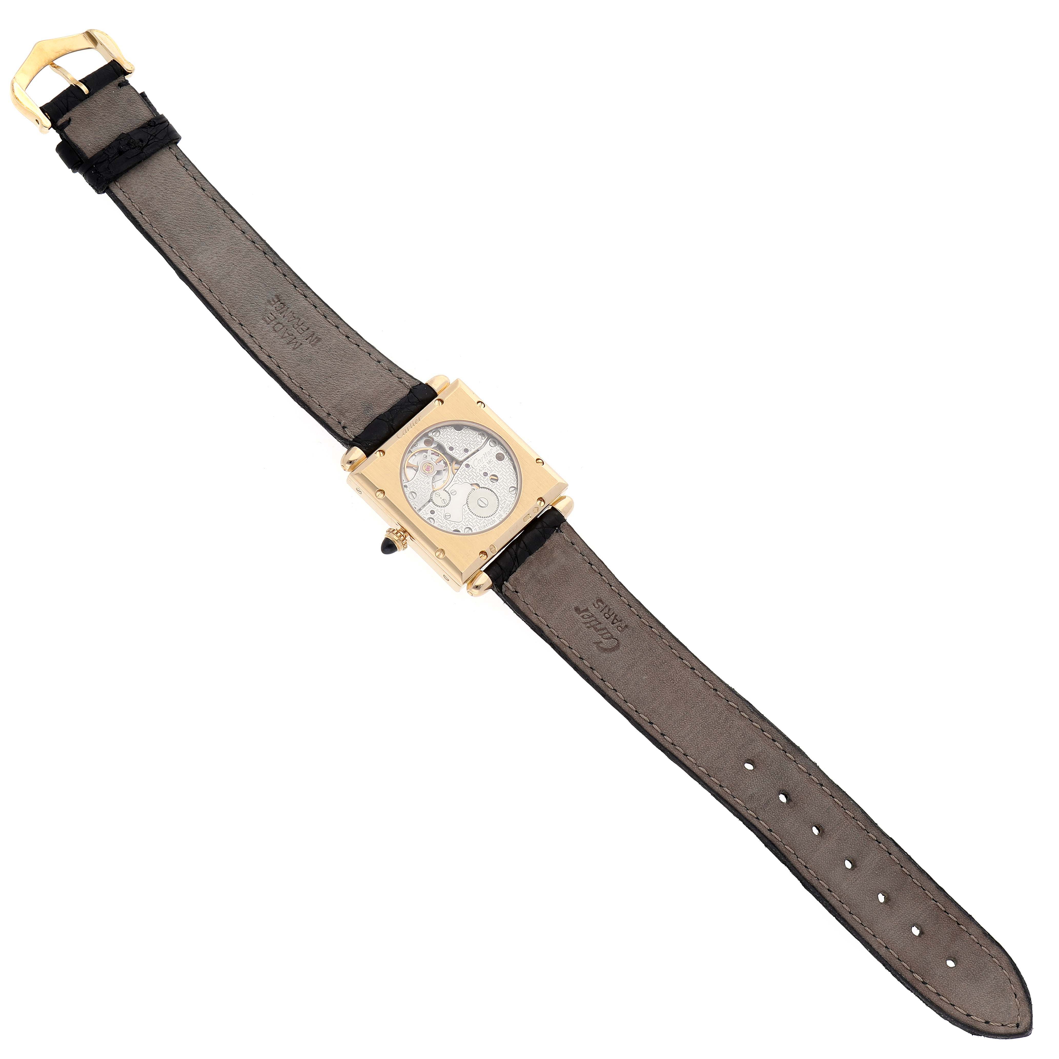 This image shows a full view of the Cartier Tank Obus W1527551 Men's Yellow Gold Silver Dial W1527551 Men's Yellow Gold Silver Dial watch, highlighting its strap, dial, and case from a top-down angle.