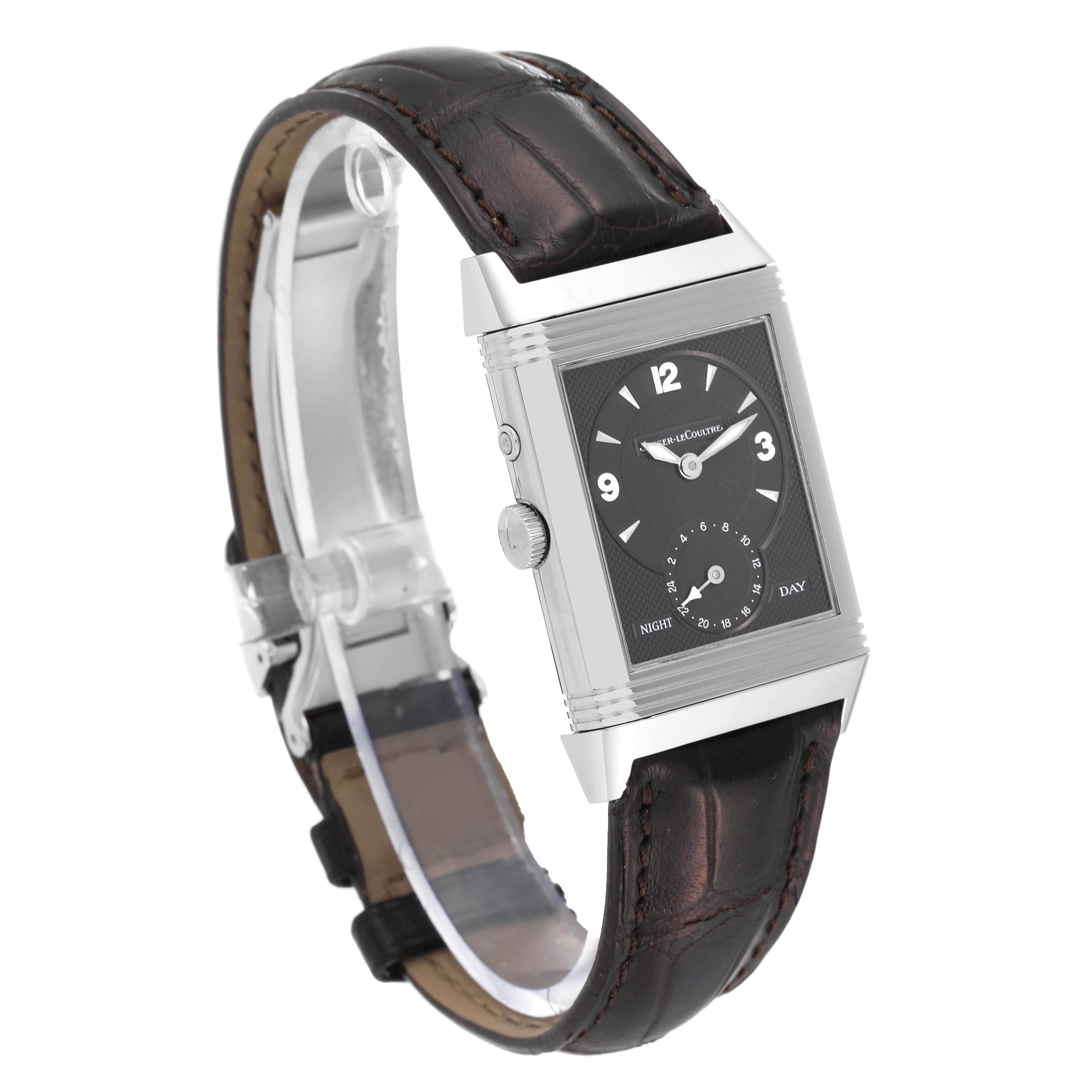 The image shows a Jaeger-LeCoultre Reverso watch at a slight side angle, highlighting its rectangular dial and leather strap.