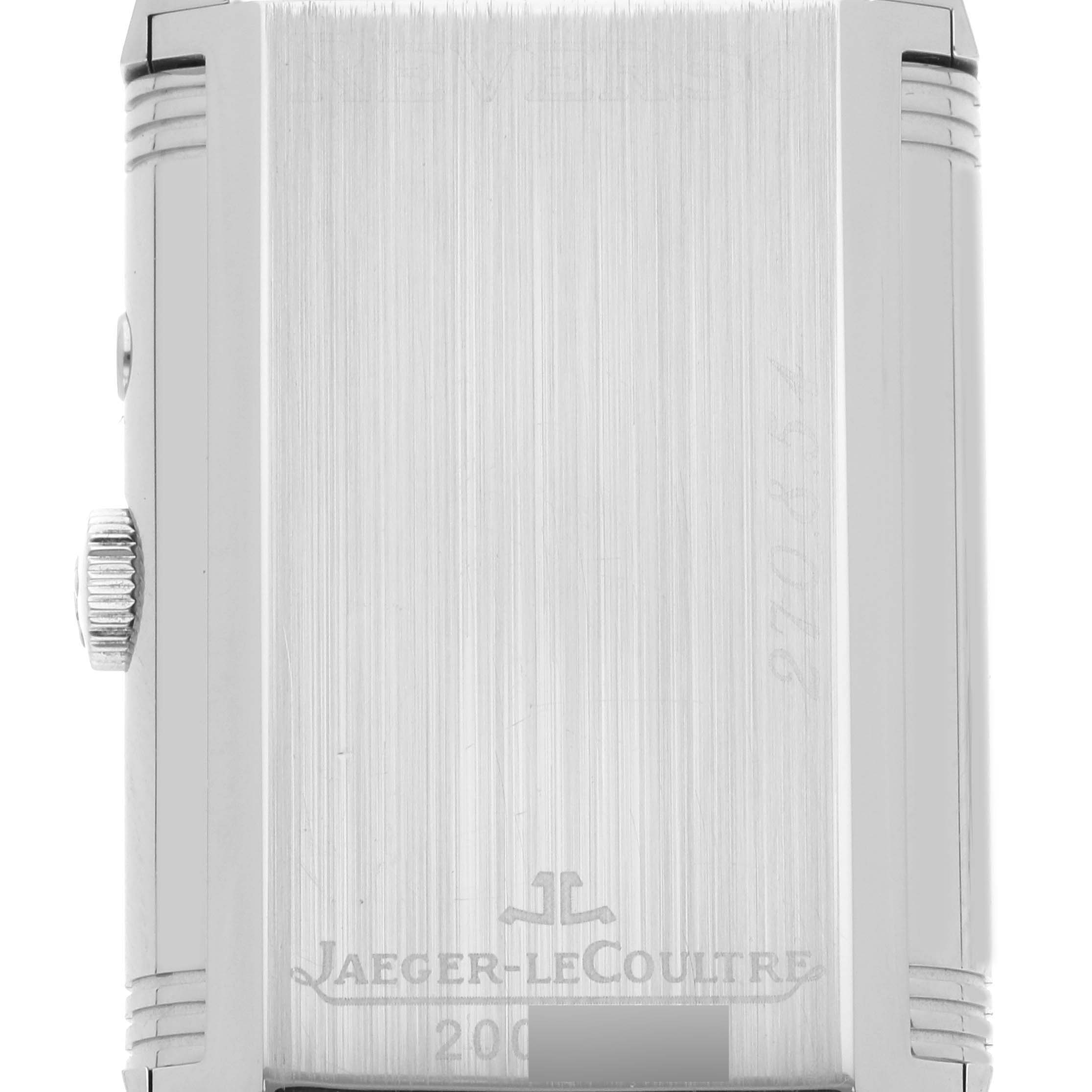 This image shows the case back of the Jaeger-LeCoultre Reverso watch, featuring the brand logo and some engraved details.