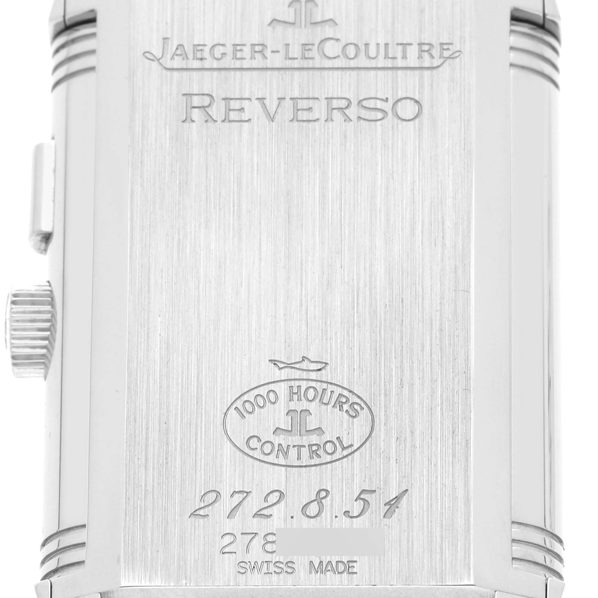 The image shows the back of the Jaeger-LeCoultre Reverso watch, highlighting its engravings and serial number.