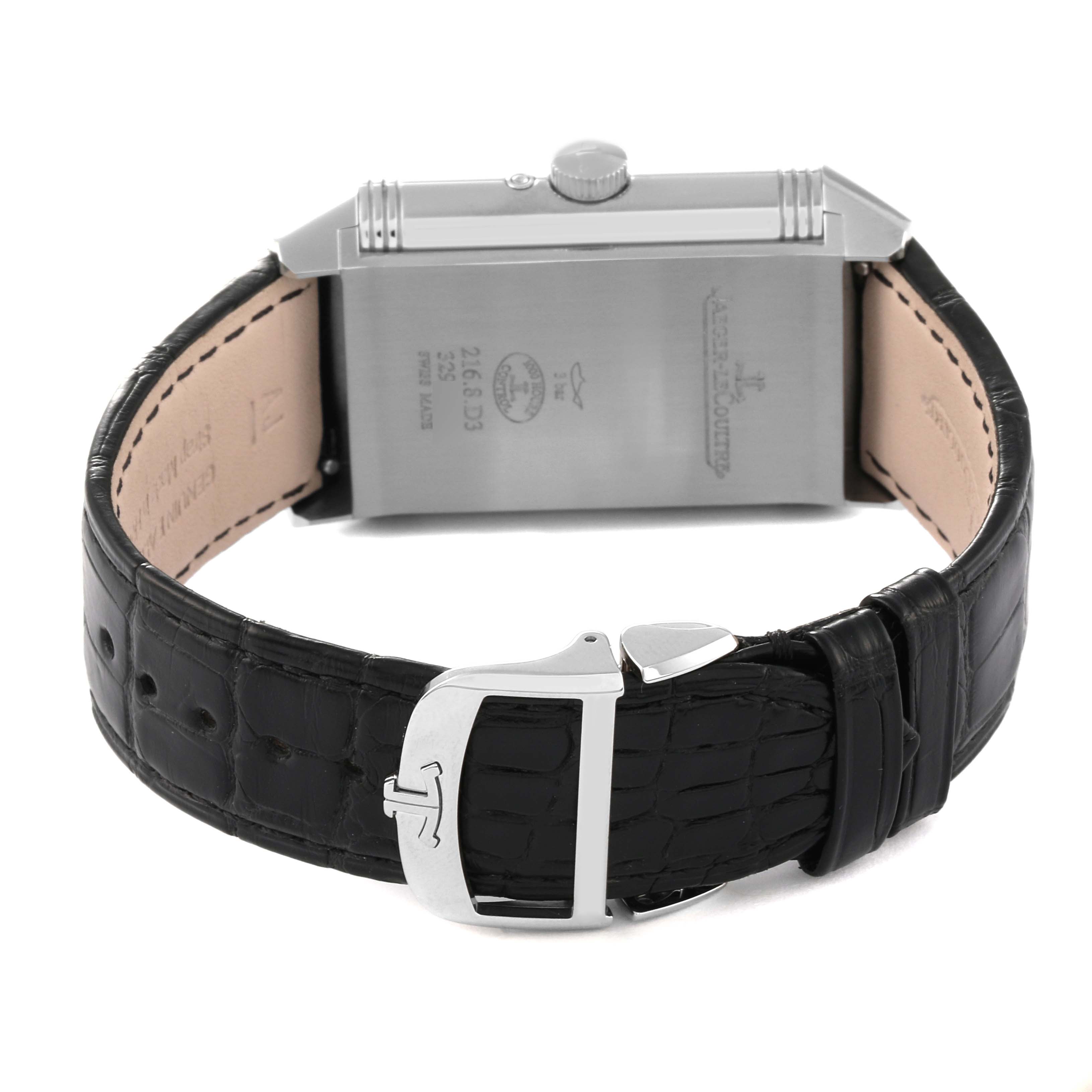 The image shows the back and clasp of the Jaeger LeCoultre Reverso Q3958420 Men's Stainless Steel Blue Dial Q3958420 Men's Stainless Steel Blue Dial watch, highlighting its leather strap and engraved caseback details.