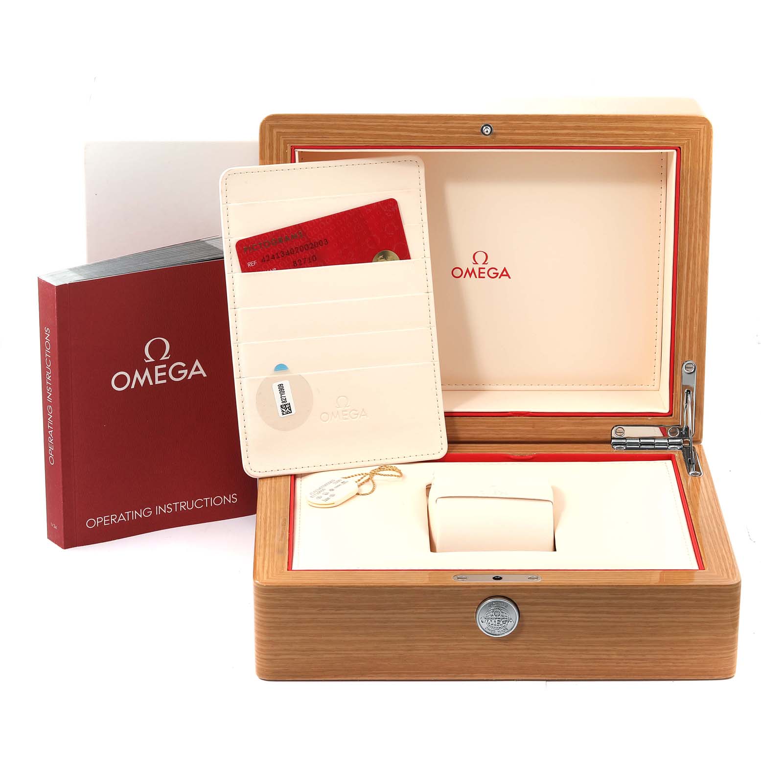 The image shows the packaging and accessories of the Omega De Ville 424.13.40.20.02.003 Men
s Stainless Steel Grey Dial 424.13.40.20.02.003 Men
s Stainless Steel Grey Dial model, including the watch box, instruction manual, and cardholder.