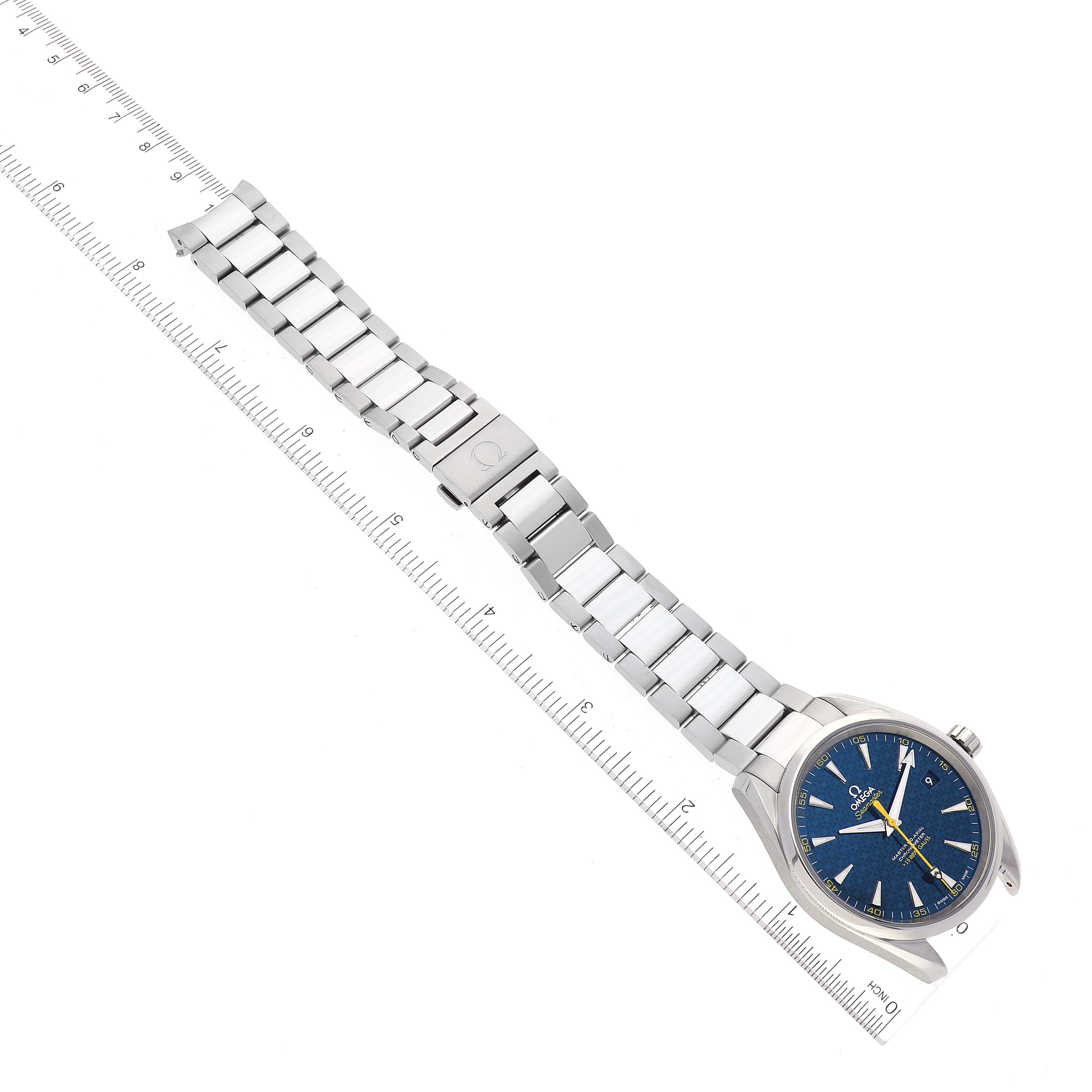 The image shows an Omega Aqua Terra 231.10.42.21.03.004 Men's Stainless Steel Blue Dial 231.10.42.21.03.004 Men's Stainless Steel Blue Dial watch laid flat, displaying its blue face, case, and metal bracelet alongside a ruler for scale.