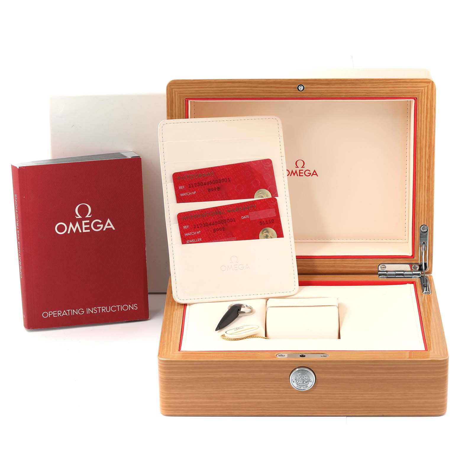 The image shows an Omega Seamaster 212.30.44.50.03.001 Men
s Stainless Steel Blue Dial 212.30.44.50.03.001 Men
s Stainless Steel Blue Dial model
s accessories, including a wooden watch box, warranty cards, and an operating instructions manual.