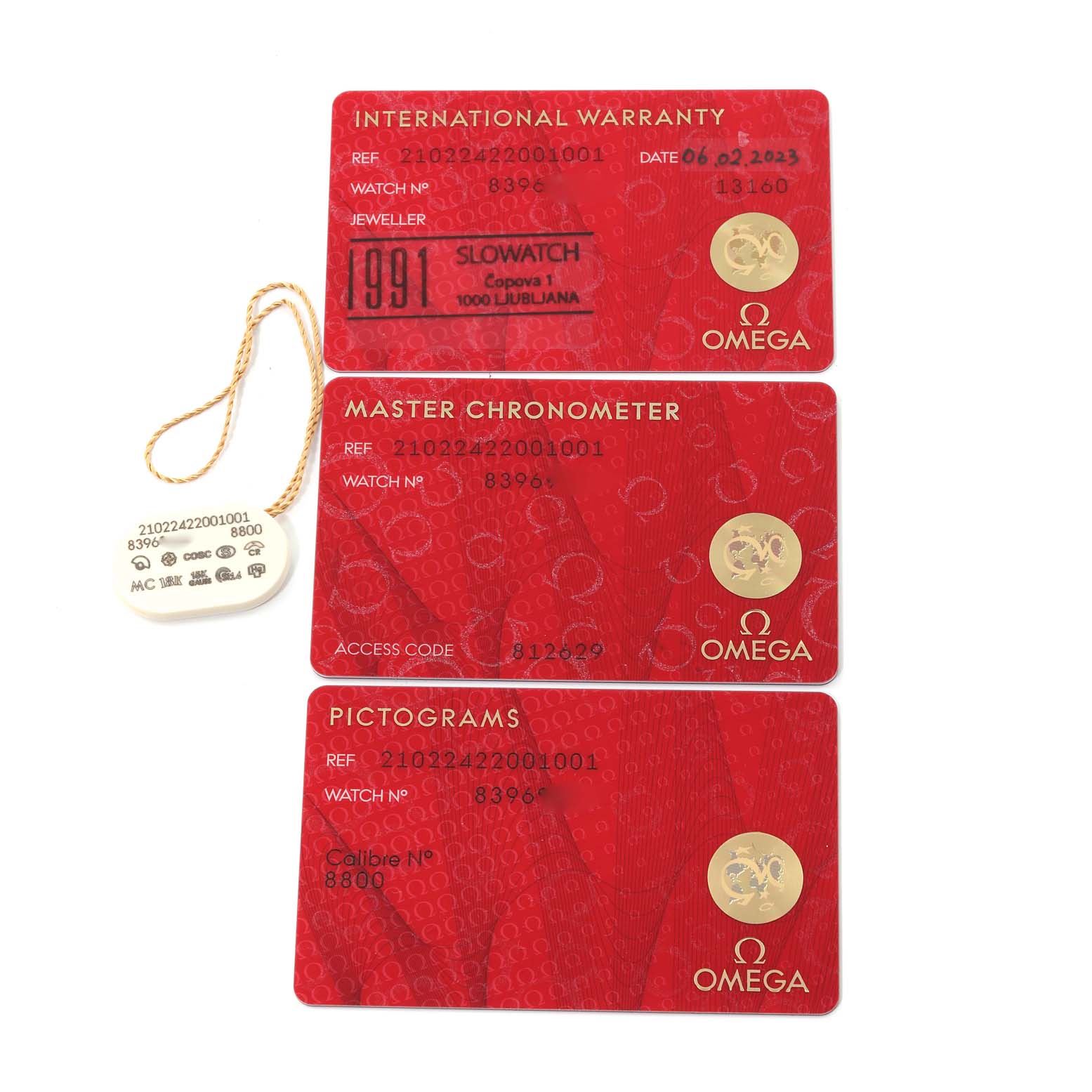 The image shows warranty and identification cards for the Omega Seamaster 210.22.42.20.01.001 Men's Steel and Gold (two tone) Black Dial 210.22.42.20.01.001 Men's Steel and Gold (two tone) Black Dial watch model, viewed from above.