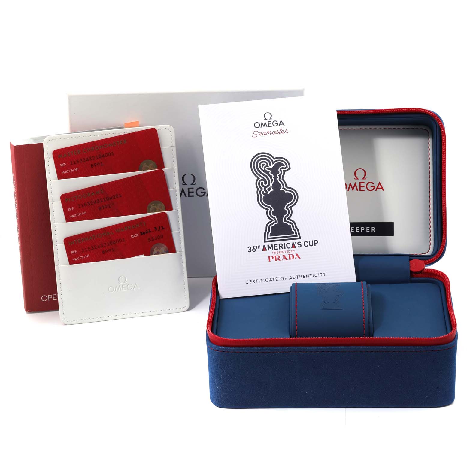 The image shows the Omega Planet Ocean 215.32.43.21.04.001 Men's Stainless Steel White Dial 215.32.43.21.04.001 Men's Stainless Steel White Dial watch box, certificate of authenticity, warranty cards, and documentation.