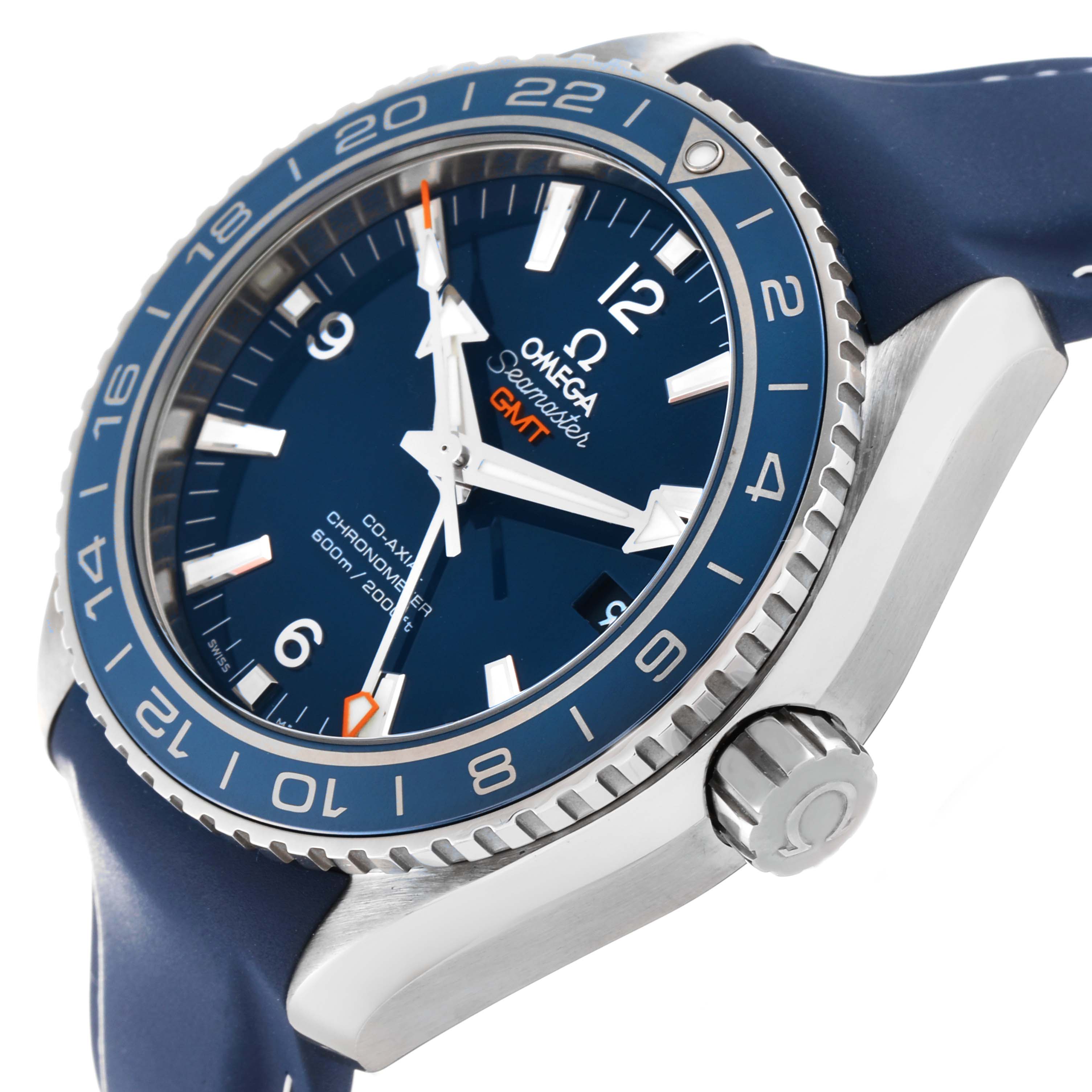 The image shows a close-up angle of the Omega Planet Ocean 232.92.44.22.03.001 Men
s Titanium Blue Dial 232.92.44.22.03.001 Men
s Titanium Blue Dial GMT watch, highlighting its bezel, crown, and part of the blue strap.