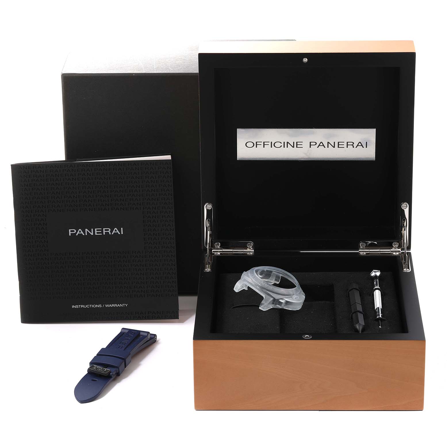 The image shows a Panerai Luminor PAM01033 Men's Stainless Steel Blue Dial PAM01033 Men's Stainless Steel Blue Dial watch box, instruction book, a spare strap, and watch tools from a top angle.