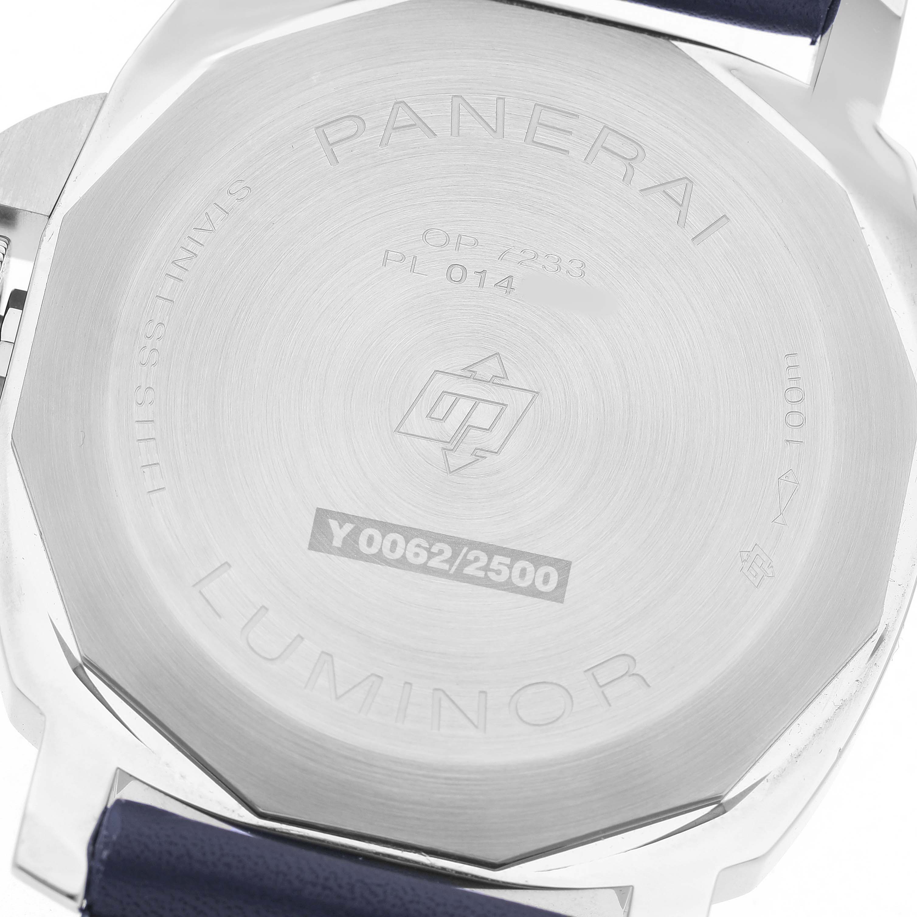 The image shows the back of the Panerai Luminor PAM01085 Men's Stainless Steel Blue Dial watch, highlighting engravings and strap attachment.