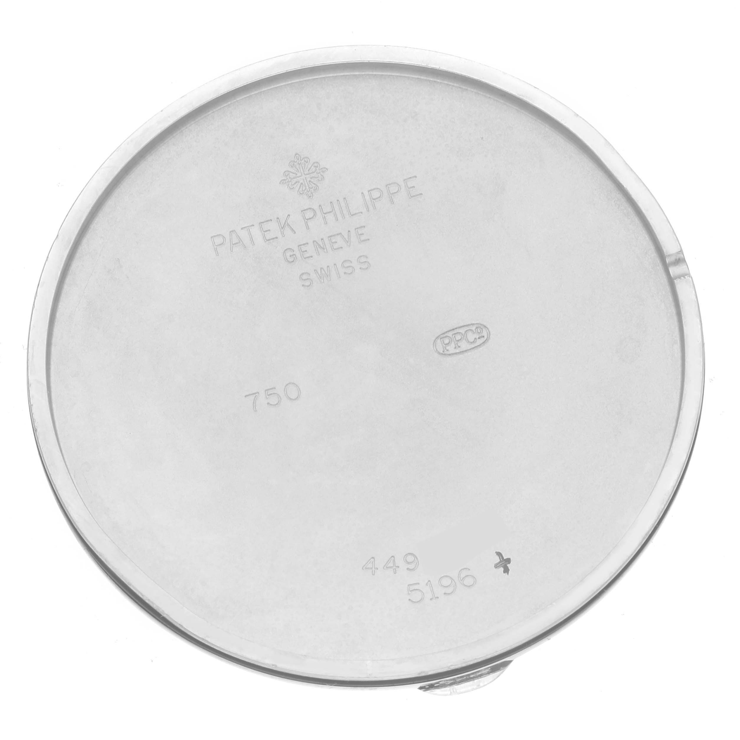 This image shows the inner case back of a Patek Philippe Calatrava 5196G Men
s White Gold Silver Dial 5196G Men
s White Gold Silver Dial model watch, displaying engravings and hallmarks.