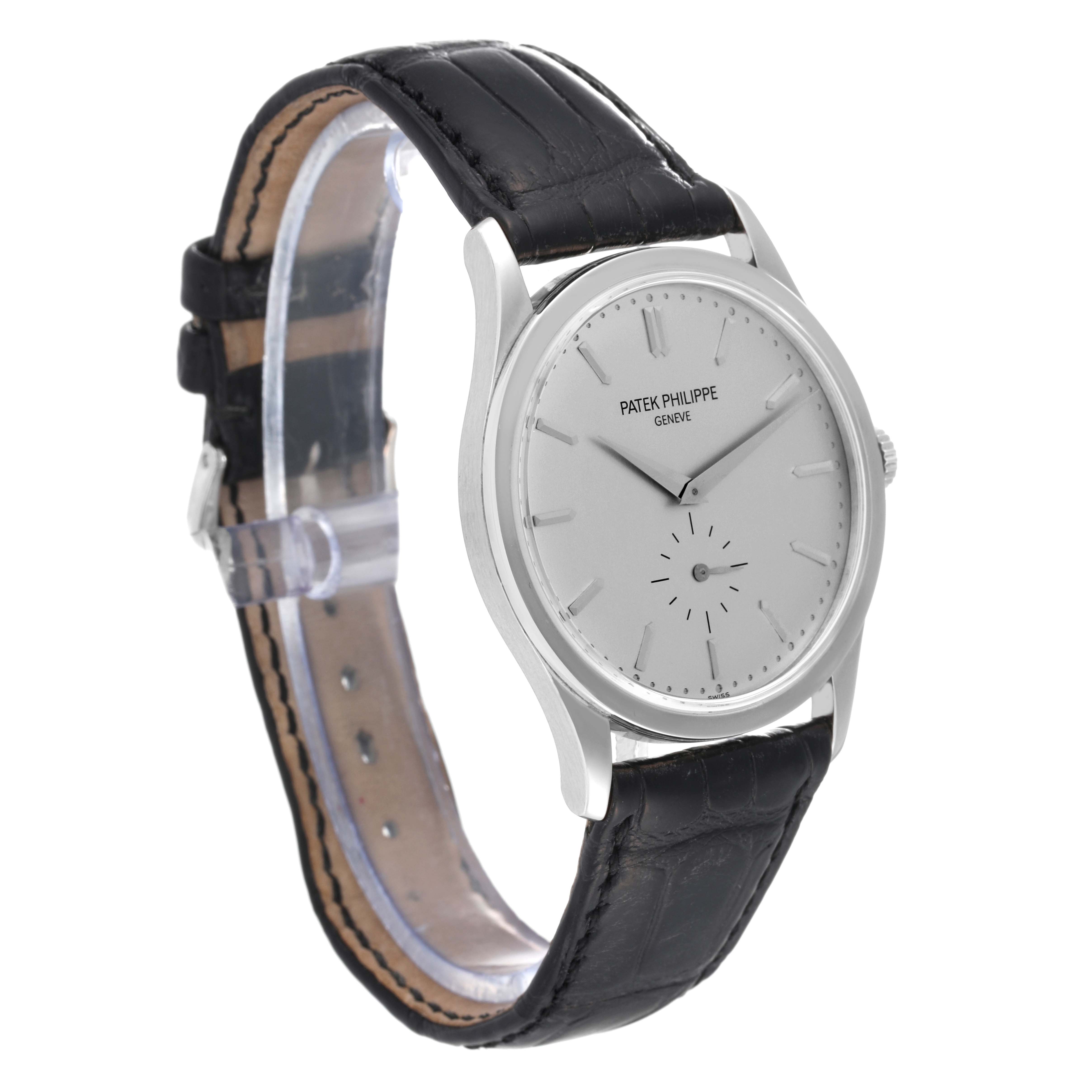 The image shows a side angle of a Patek Philippe Calatrava 5196G Men
s White Gold Silver Dial 5196G Men
s White Gold Silver Dial watch, highlighting its leather strap and minimalist dial.