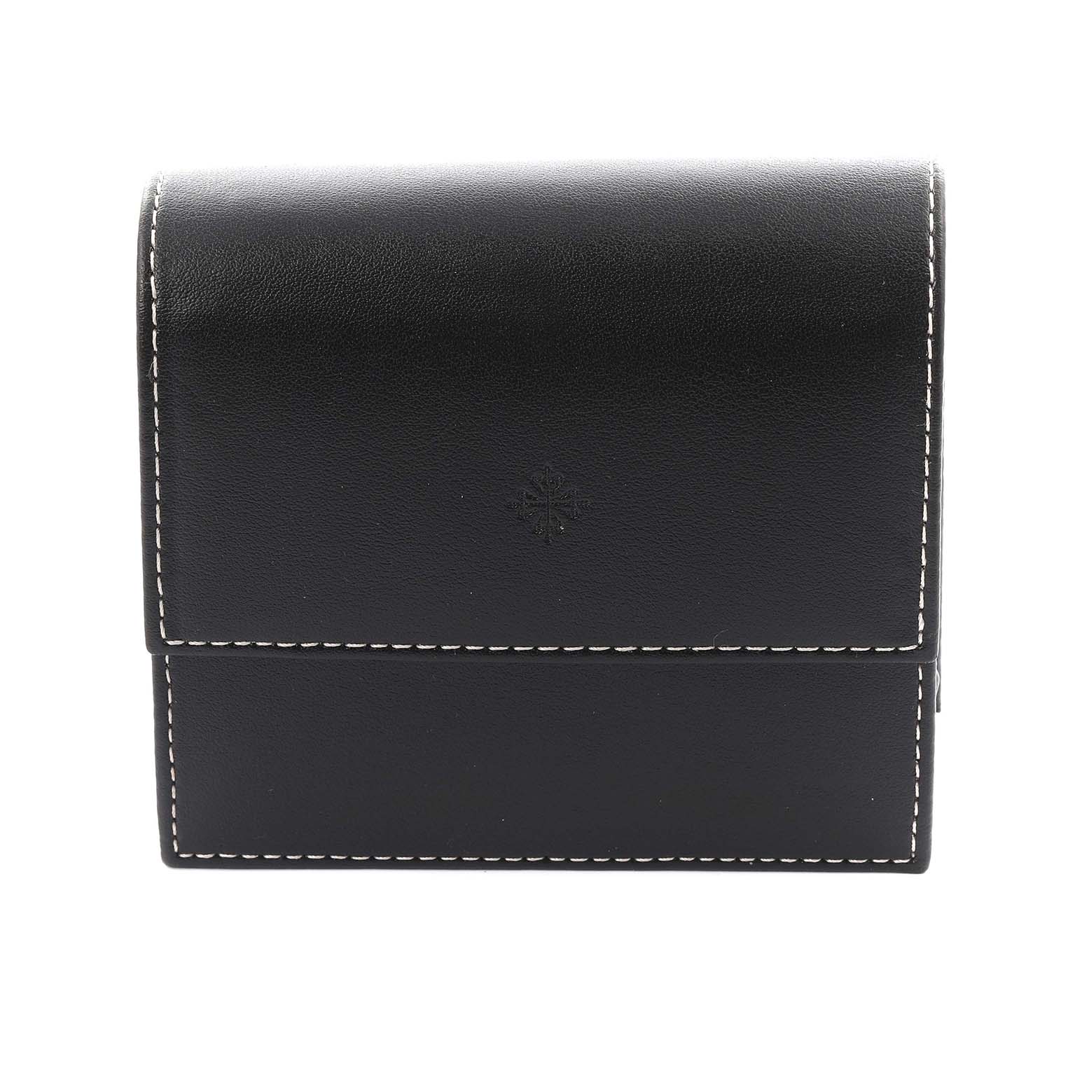 This image shows a black leather case with white stitching for a Patek Philippe Gondolo 4825/101J Women's Yellow Gold White Dial 4825/101J Women's Yellow Gold White Dial watch, viewed from the front.