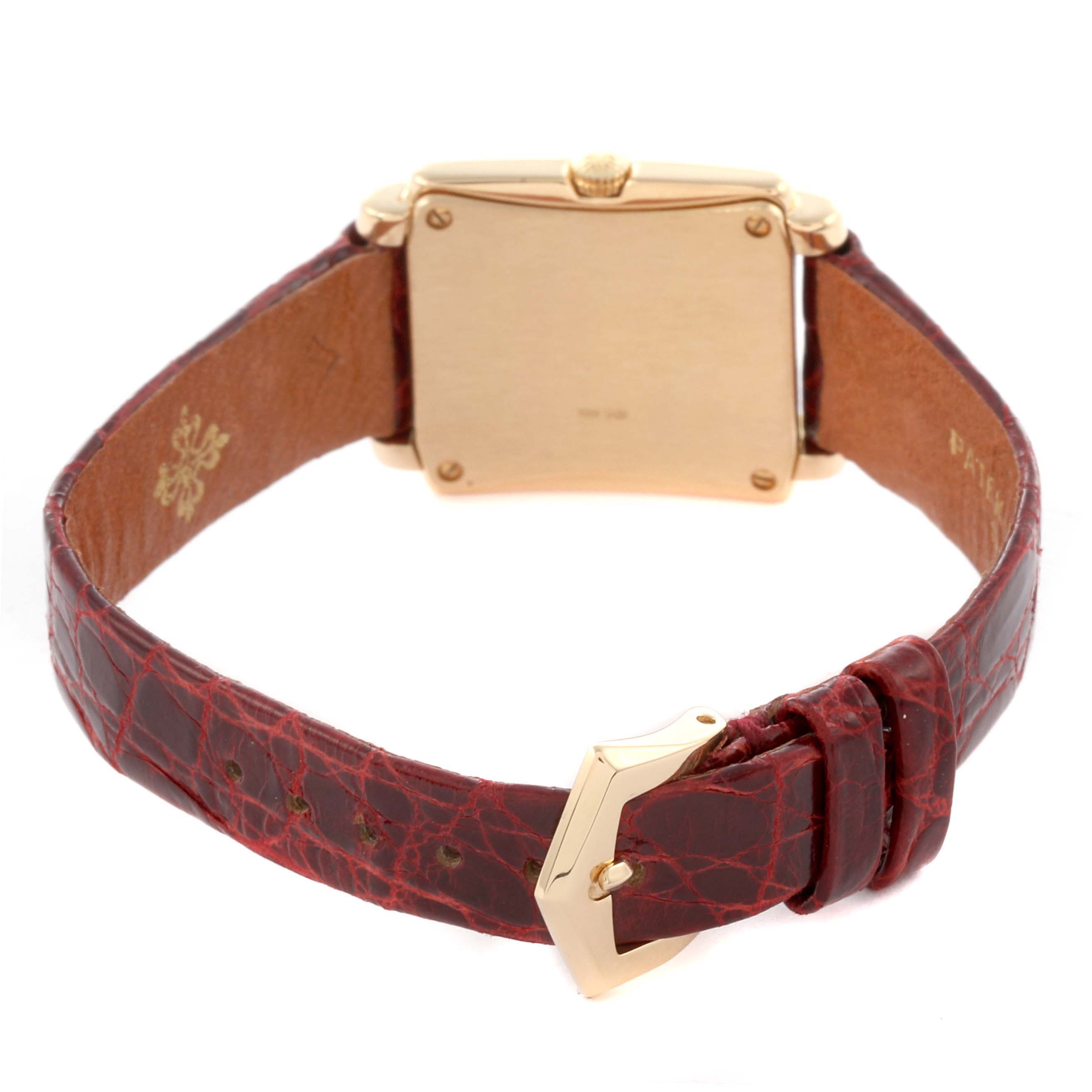 The image shows the back view of the Patek Philippe Gondolo 4825/101J Women's Yellow Gold White Dial 4825/101J Women's Yellow Gold White Dial watch, highlighting the case back and leather strap with a buckle.