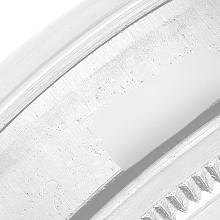 The image shows a close-up of the bezel and part of the case for a Rolex Date 1500 Men
s Stainless Steel Silver Dial 1500 Men
s Stainless Steel Silver Dial watch.