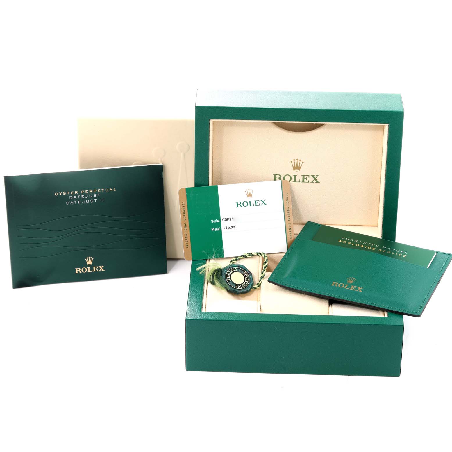 The image shows the packaging and accessories for a Rolex Datejust 116200 Men's Stainless Steel White Dial 116200 Men's Stainless Steel White Dial, including manuals, guarantee card, and the presentation box.