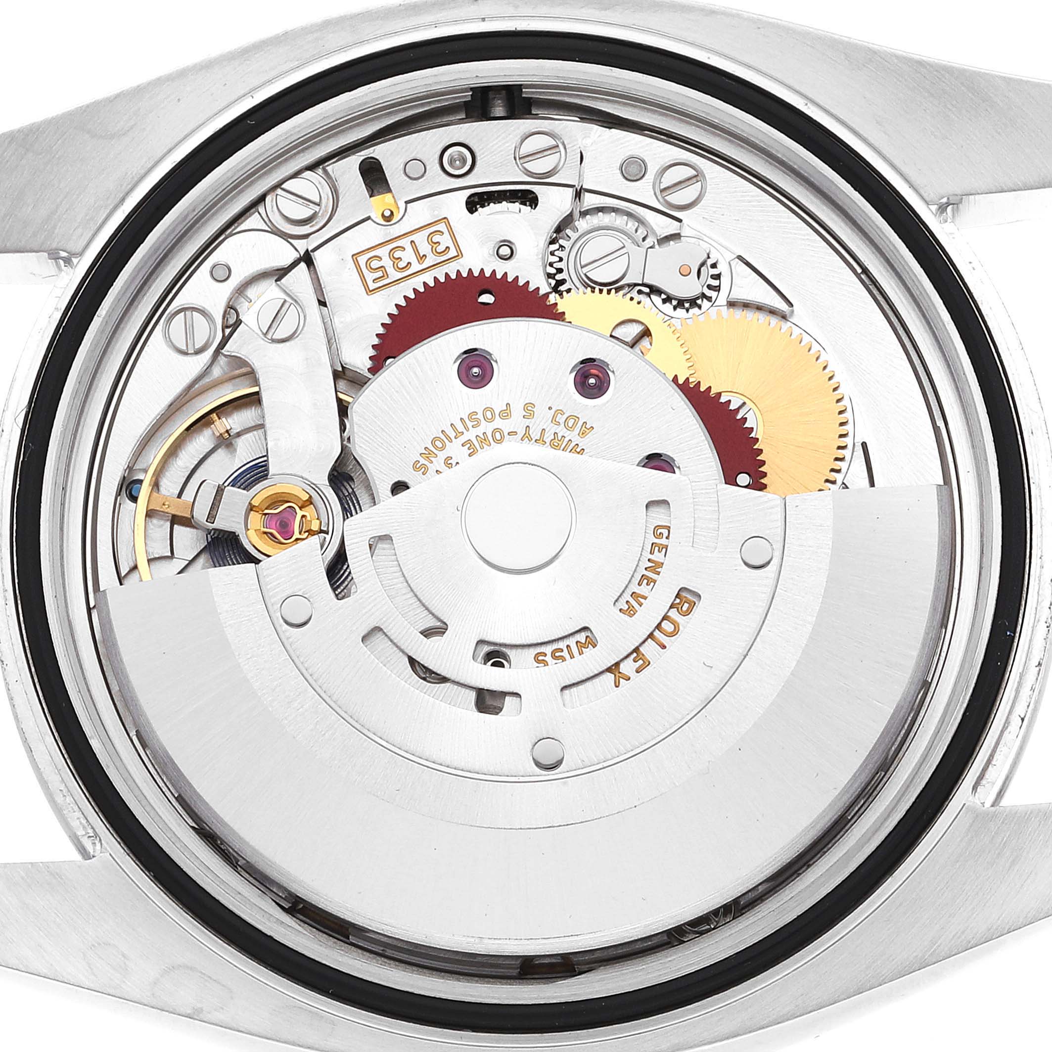 This image shows the inner mechanical workings and movement of a Rolex Datejust 116200 Men's Stainless Steel White Dial 116200 Men's Stainless Steel White Dial watch, viewed from the back side.