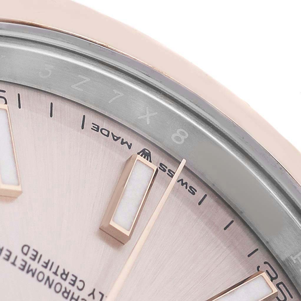 The image shows a close-up of the dial and chapter ring of the Rolex Datejust 41 126301 Men's Steel and Gold (two tone) Pink Dial, highlighting markers and "Swiss Made" text.