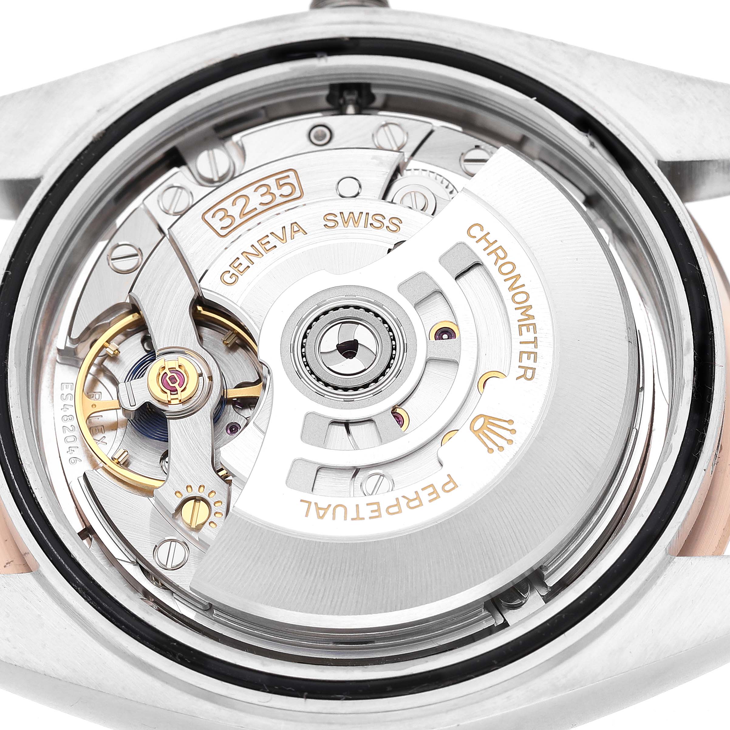 The image shows the movement of a Rolex Datejust 41 126301 Men's Steel and Gold (two tone) Pink Dial, highlighting its detailed mechanical parts from a rear angle.