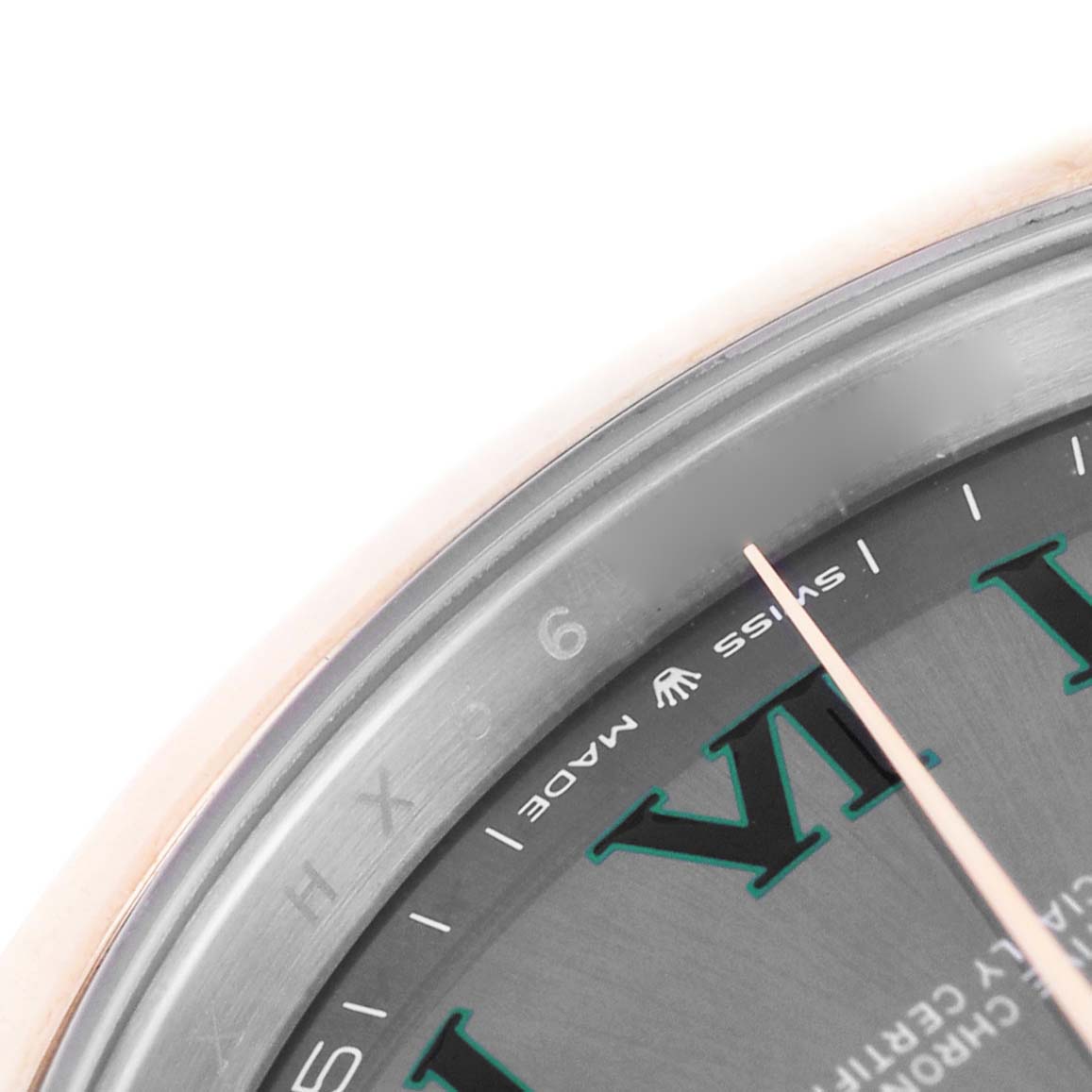 This close-up of the Rolex Datejust 41 126301 Men's Steel and Gold (two tone) Grey Dial shows part of the dial, focusing on the Roman numerals and minute markers.