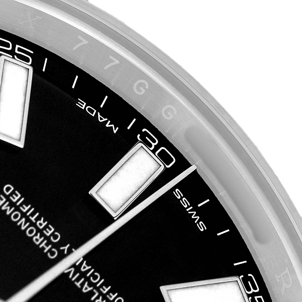 The image shows a close-up of the dial and bezel of a Rolex Datejust 41 116300 Men's Stainless Steel Black Dial, highlighting indices and part of the second hand.