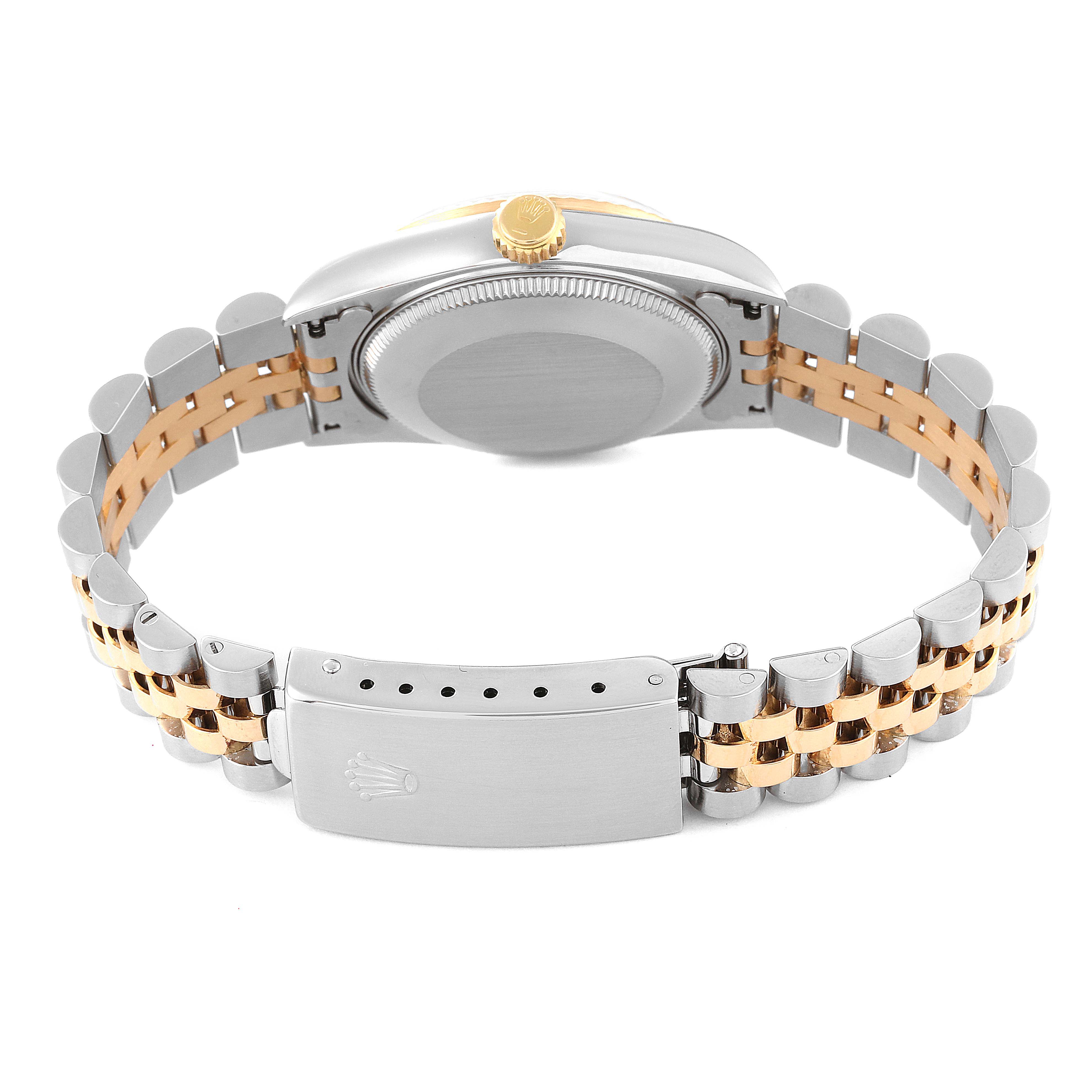 The watch is a Mid-Size Rolex model, shown from the back, highlighting the clasp, bracelet, and case back.