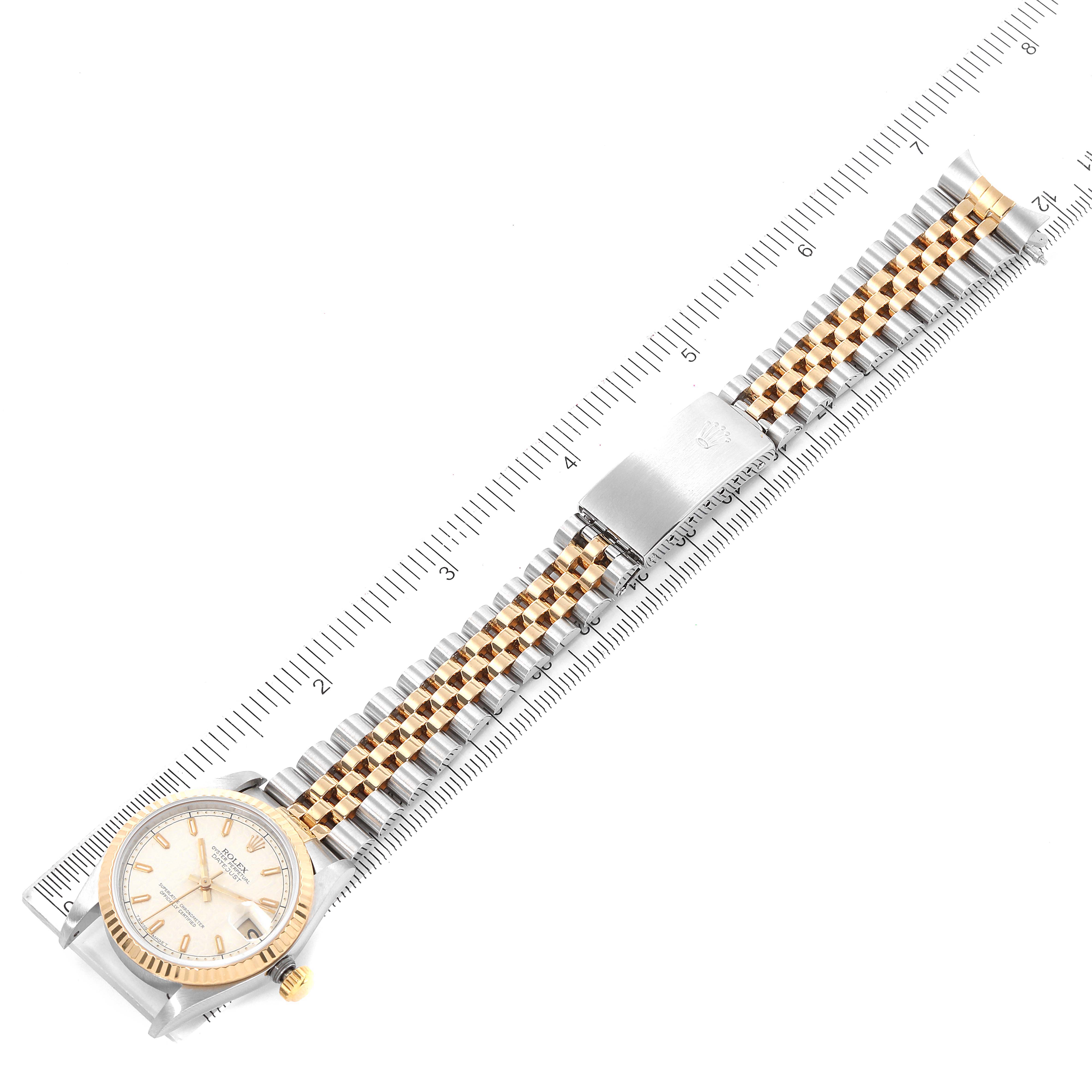 The image shows a Rolex Mid-Size 68273 Women's Steel and Gold (two tone) Beige Dial 68273 Women's Steel and Gold (two tone) Beige Dial watch laid flat, displaying the face, bezel, and full bracelet against a ruler for size reference.