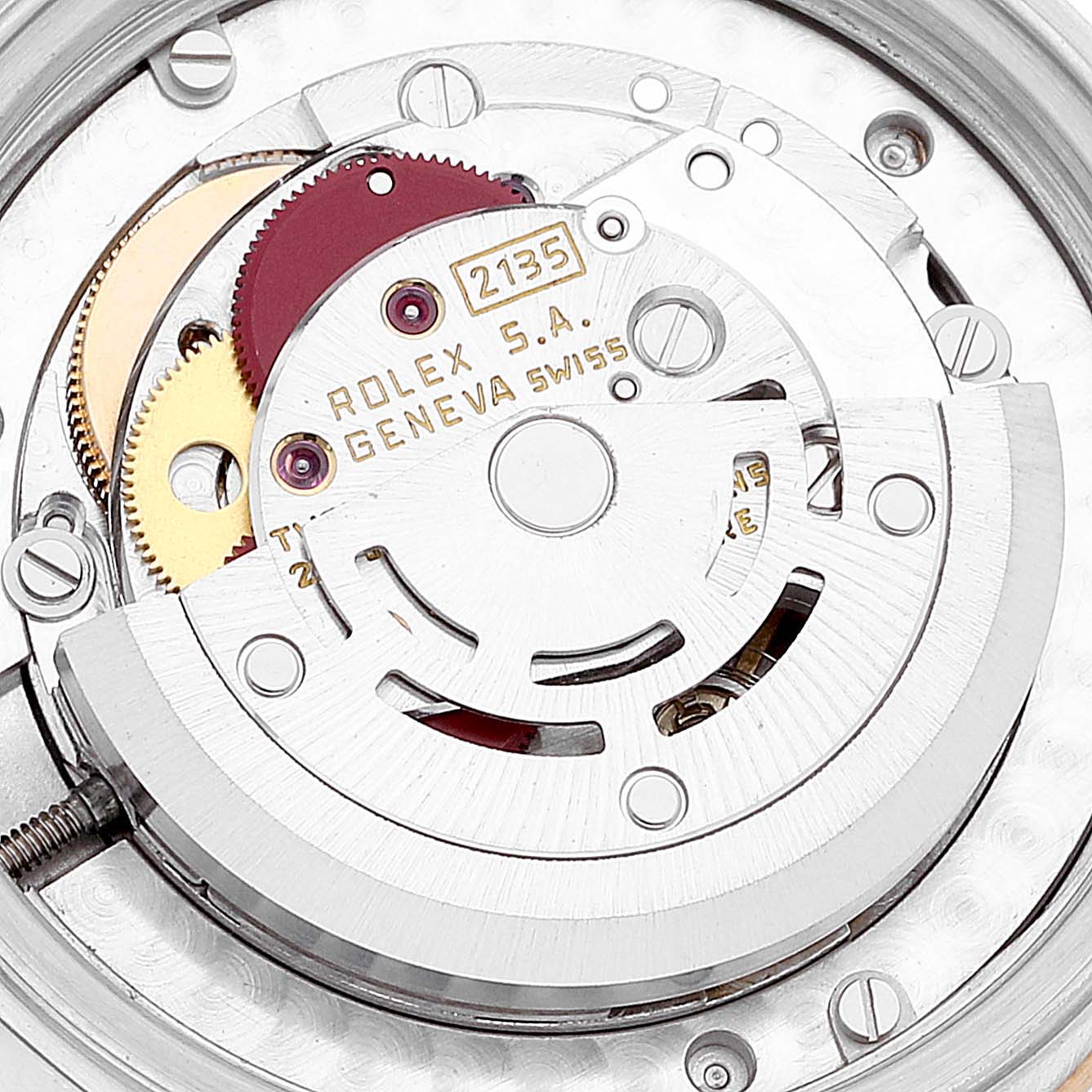 This image shows a close-up view of the movement and internal mechanism of a Mid-Size Rolex watch model 2135.