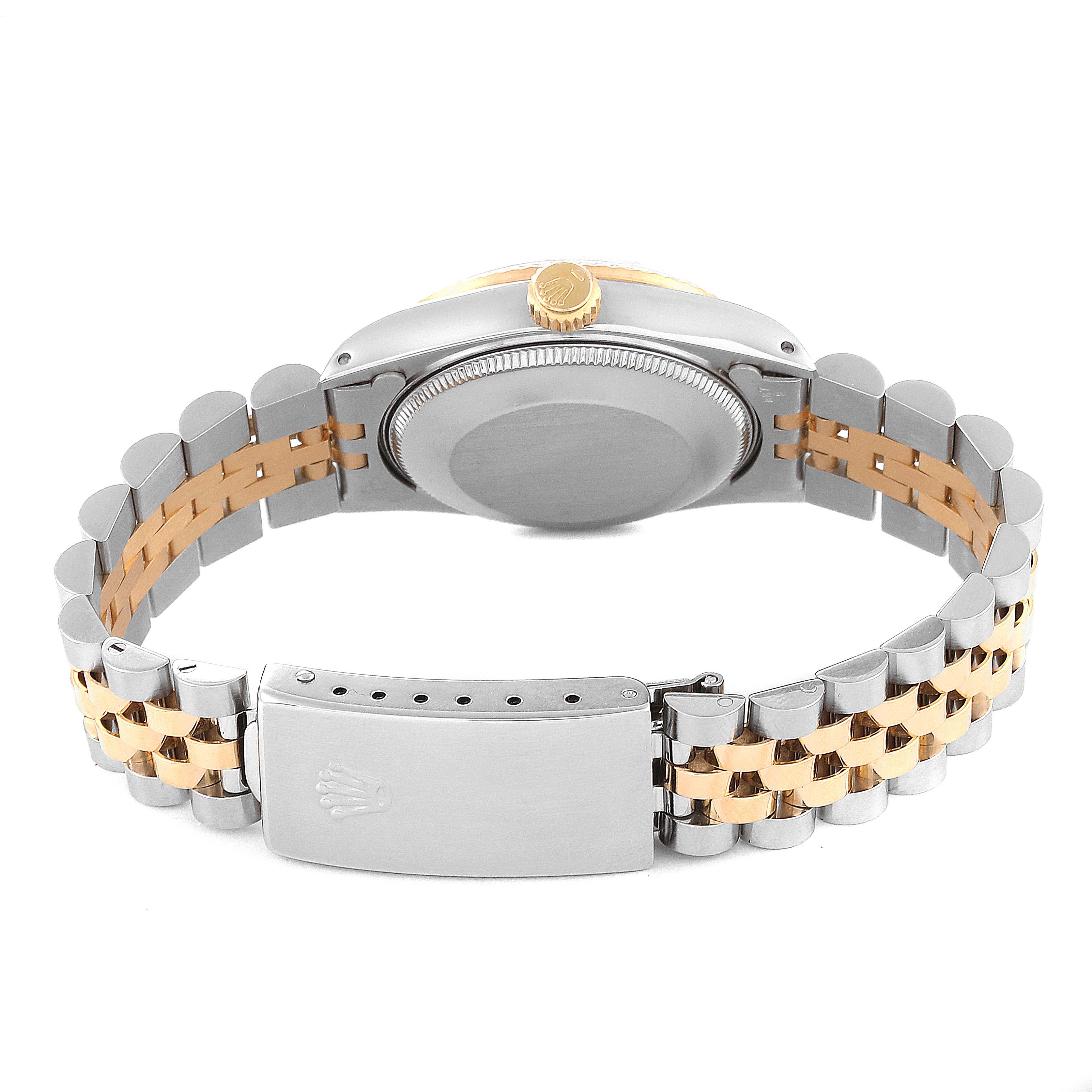 The image shows the back view of a Rolex Mid-Size 68273 Women
s Steel and Gold (two tone) Black Dial 68273 Women
s Steel and Gold (two tone) Black Dial model, highlighting its case back, bracelet, and clasp.