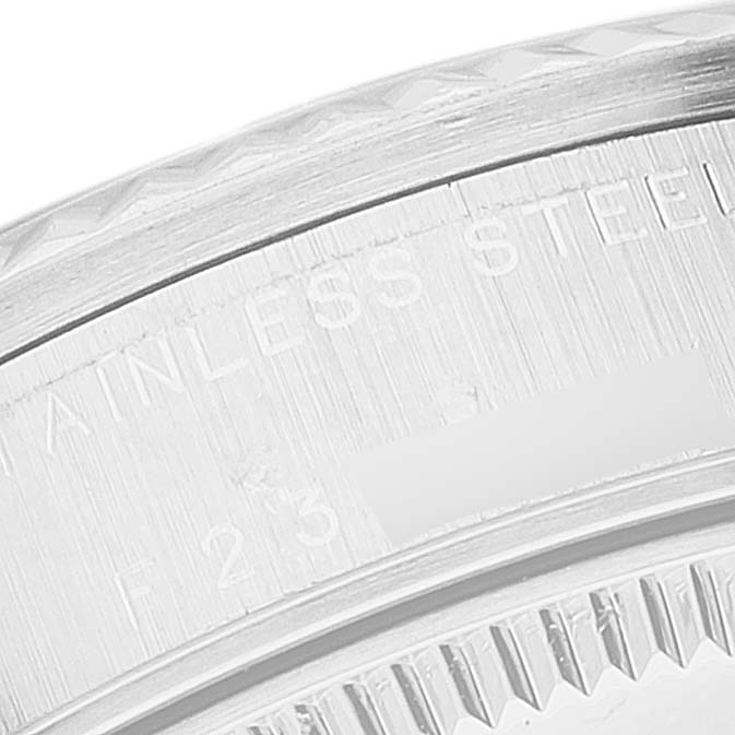 The image shows a close-up of the side of a Rolex Mid-Size 78274 Women
s Stainless Steel Silver Dial 78274 Women
s Stainless Steel Silver Dial watch, highlighting the stainless steel marking.