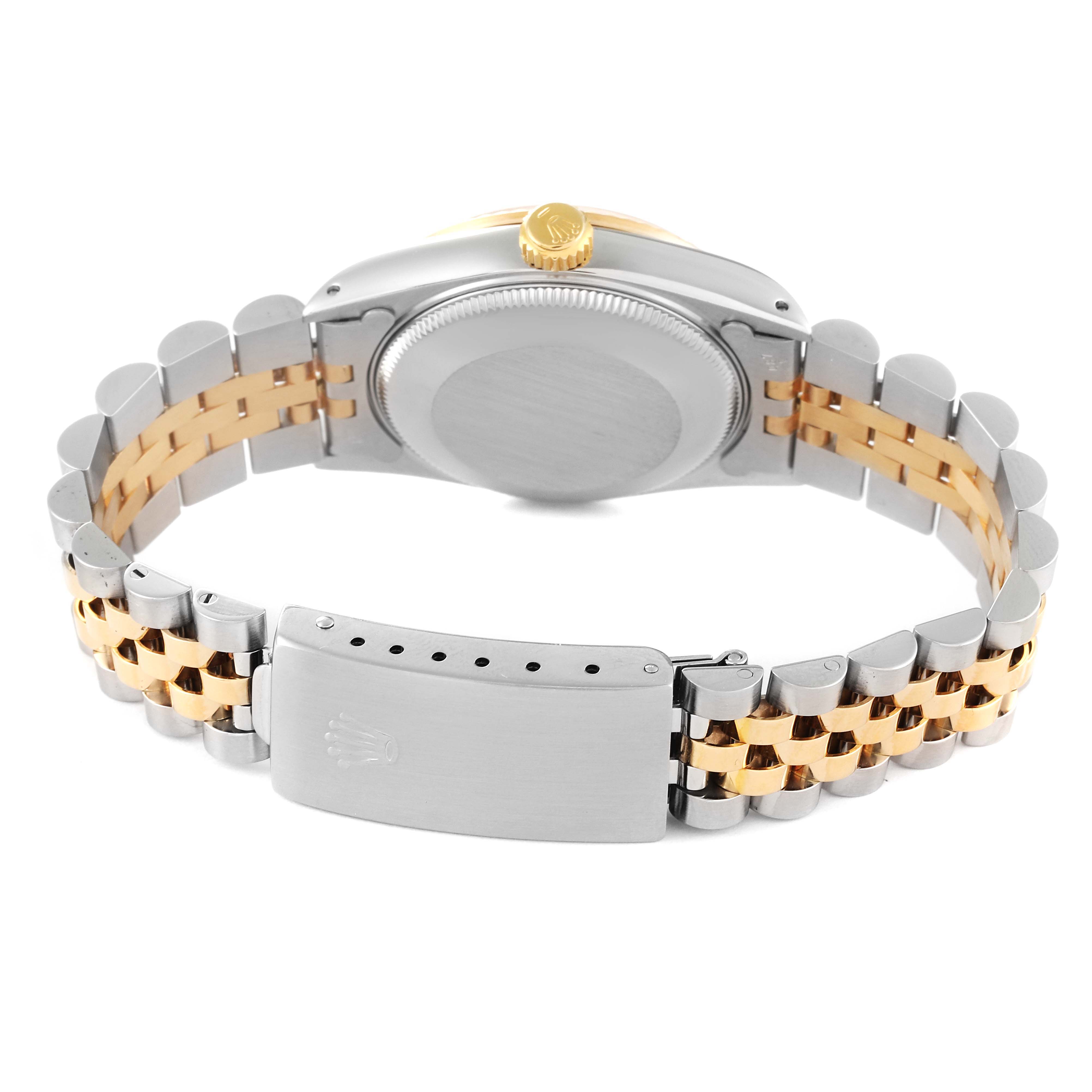 The image shows the back, clasp, and part of the bracelet of a Rolex Mid-Size 68273 Women
s Steel and Gold (two tone) Champagne Dial 68273 Women
s Steel and Gold (two tone) Champagne Dial model watch.