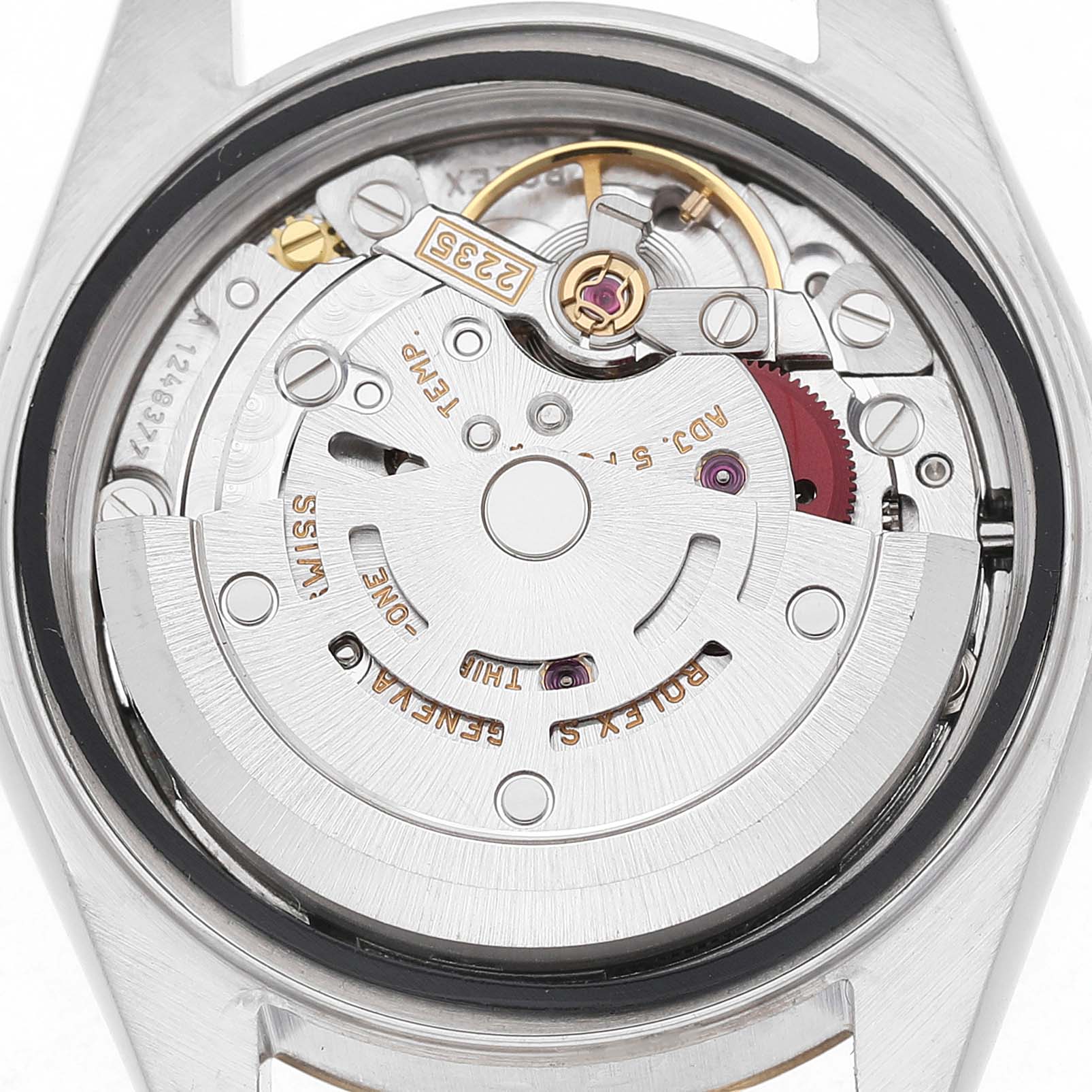 The image shows the movement of a Rolex Datejust 79173 Women's Steel and Gold (two tone) Silver Dial watch, captured from the back, highlighting its intricate mechanics.