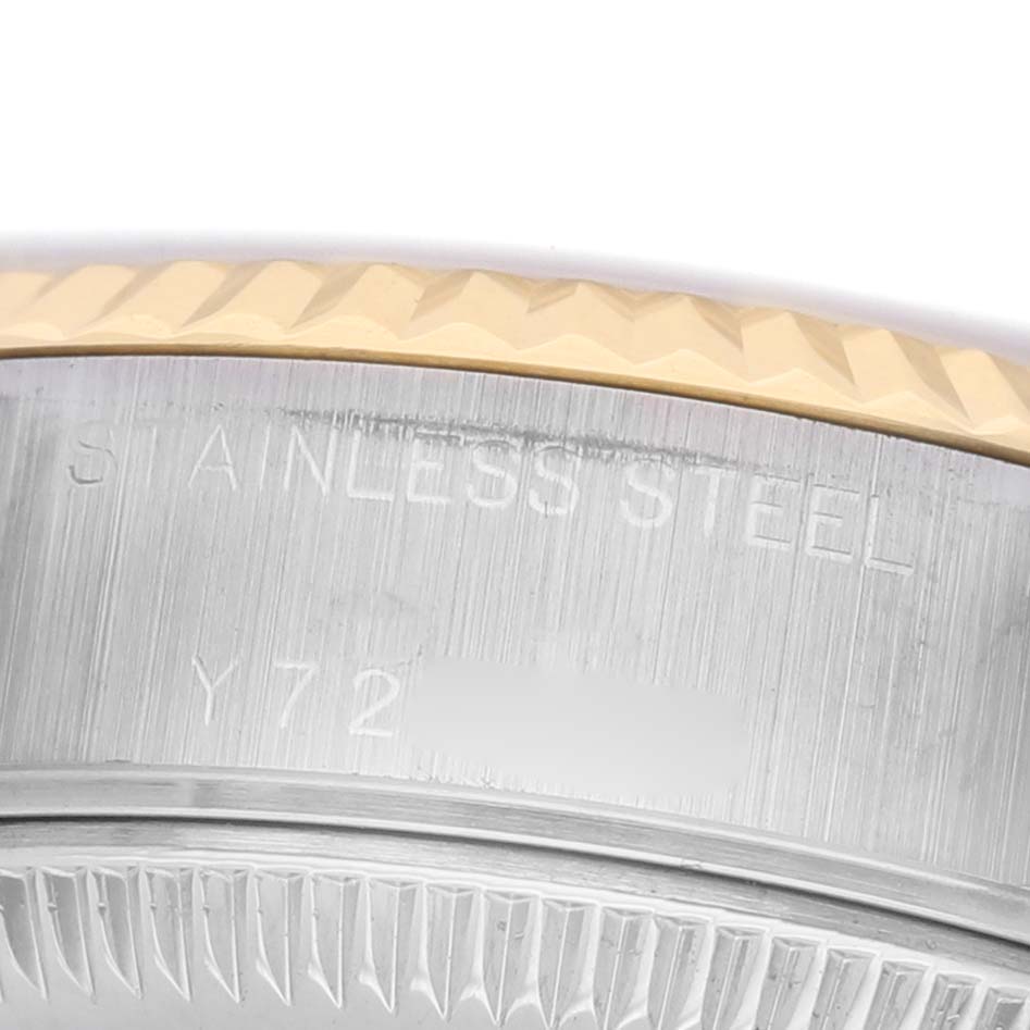 The image shows a close-up of the side engraving and bezel of a Rolex Datejust 79173 Women's Steel and Gold (two tone) Silver Dial watch.