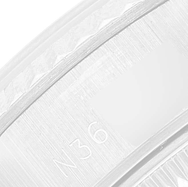 This close-up image shows the inner rim of the bezel and part of the dial of a Rolex Datejust 69174 Women's Stainless Steel Silver Dial 69174 Women's Stainless Steel Silver Dial watch.