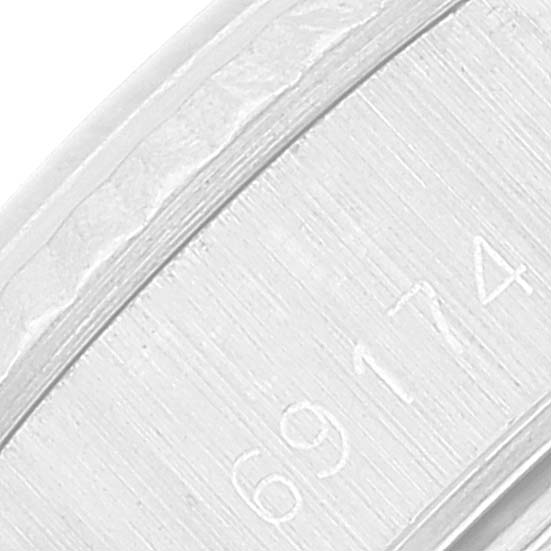 This close-up image of the Rolex Datejust 69174 Women's Stainless Steel Silver Dial 69174 Women's Stainless Steel Silver Dial watch shows the engravings on the inner part of the band.