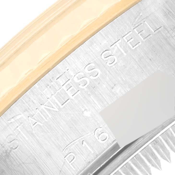 This image shows a close-up of the side of a Rolex Datejust 79173 Women's Steel and Gold (two tone) Champagne Dial 79173 Women's Steel and Gold (two tone) Champagne Dial watch, highlighting the engraved "STAINLESS STEEL" text.