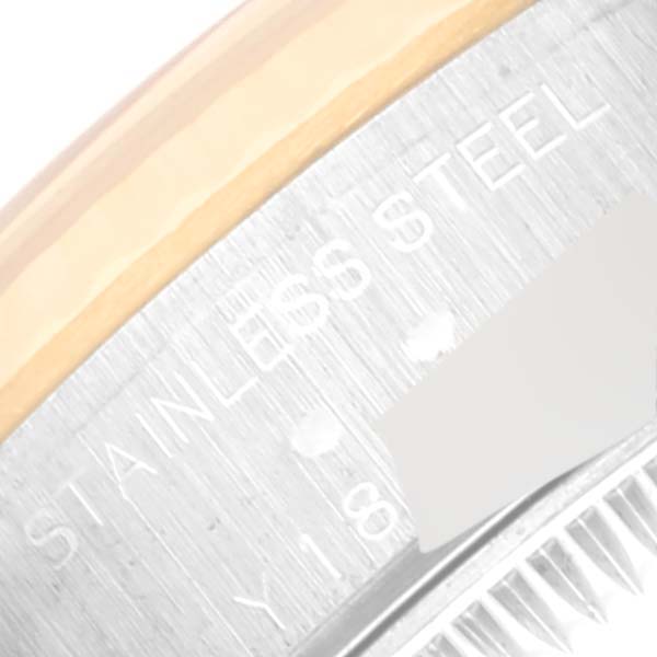 This image shows a close-up angle of the case back of a Rolex Datejust 79173 Women's Steel and Gold (two tone) Champagne Dial 79173 Women's Steel and Gold (two tone) Champagne Dial watch, highlighting the "STAINLESS STEEL" engraving.
