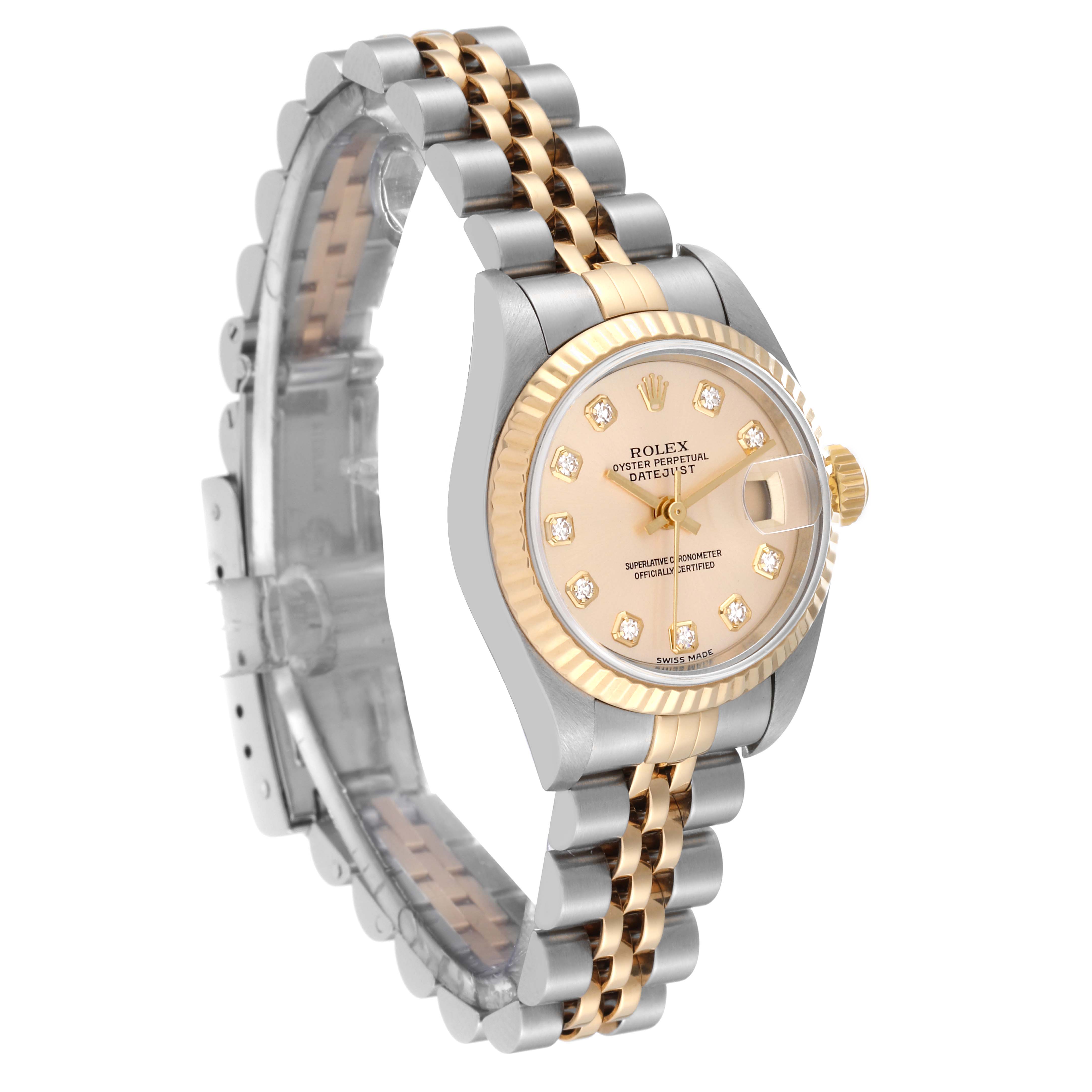The Rolex Datejust 79173 Women's Steel and Gold (two tone) Champagne Dial 79173 Women's Steel and Gold (two tone) Champagne Dial watch is shown at a three-quarter angle, highlighting its gold and silver bracelet, dial, and bezel.