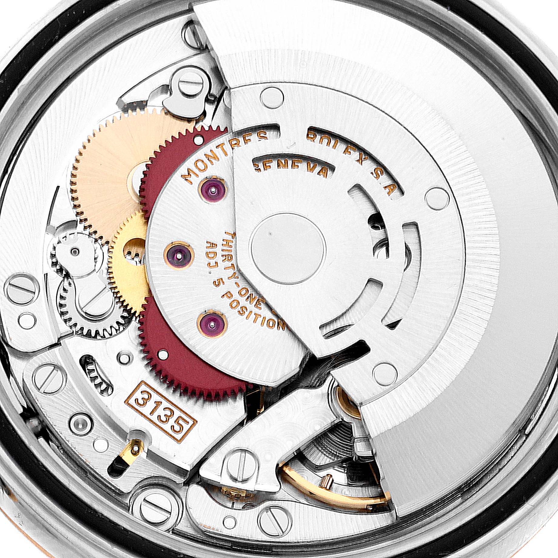 The image shows a close-up of the mechanical movement of a Rolex Datejust 16233 Men's Steel and Gold (two tone) Champagne Dial 16233 Men's Steel and Gold (two tone) Champagne Dial watch, focusing on its intricate gears and components.