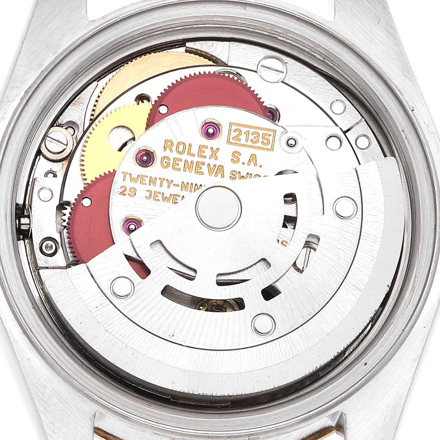 This image shows the internal mechanism of a Rolex Datejust 69173 Women's Steel and Gold (two tone) White Dial 69173 Women's Steel and Gold (two tone) White Dial watch from a rear angle, highlighting its intricate gears and movements.