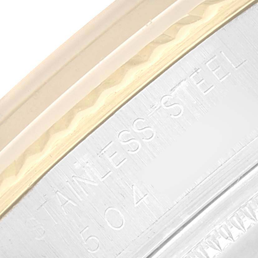 This image shows a close-up of the side of a Vintage Collection Rolex, highlighting its stainless steel engraving.